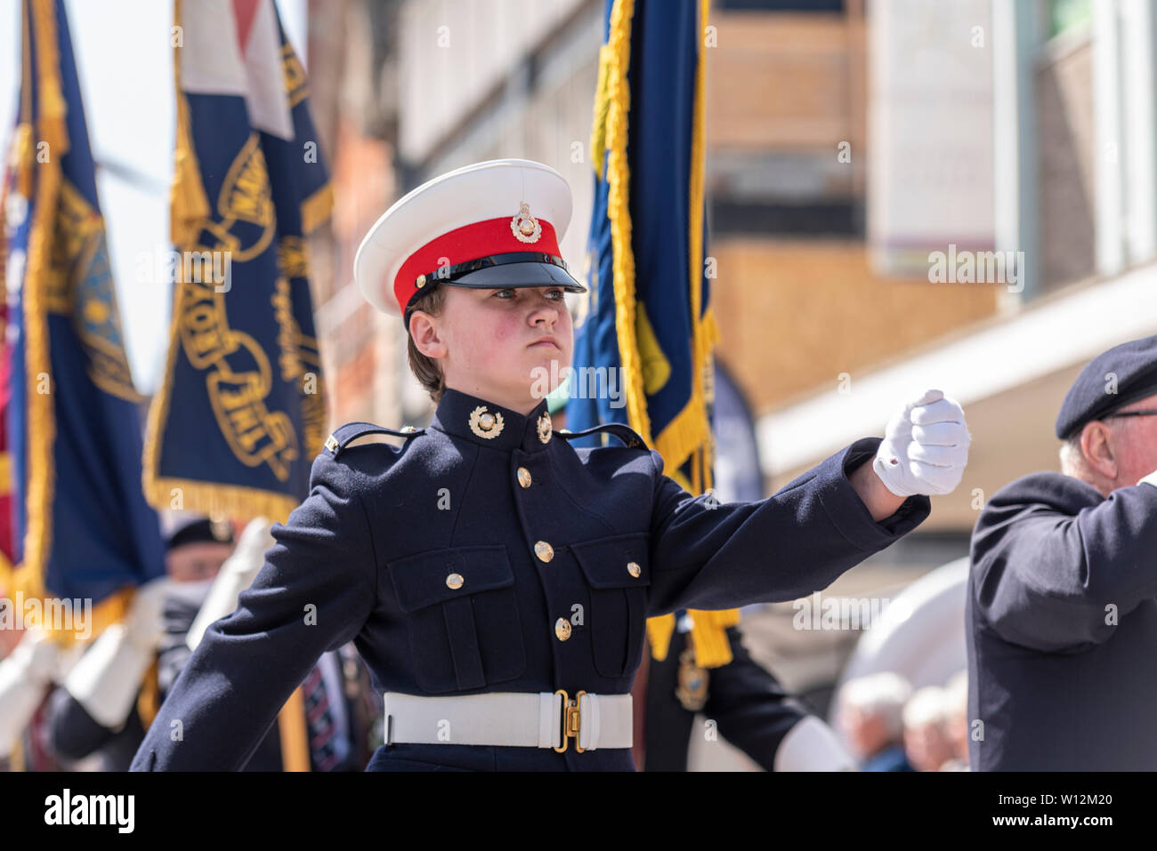 Armed Forces Day AFD commemorative military remembrance event in High Street, Southend on Sea, Essex, UK. British. Female cadet marching Stock Photo