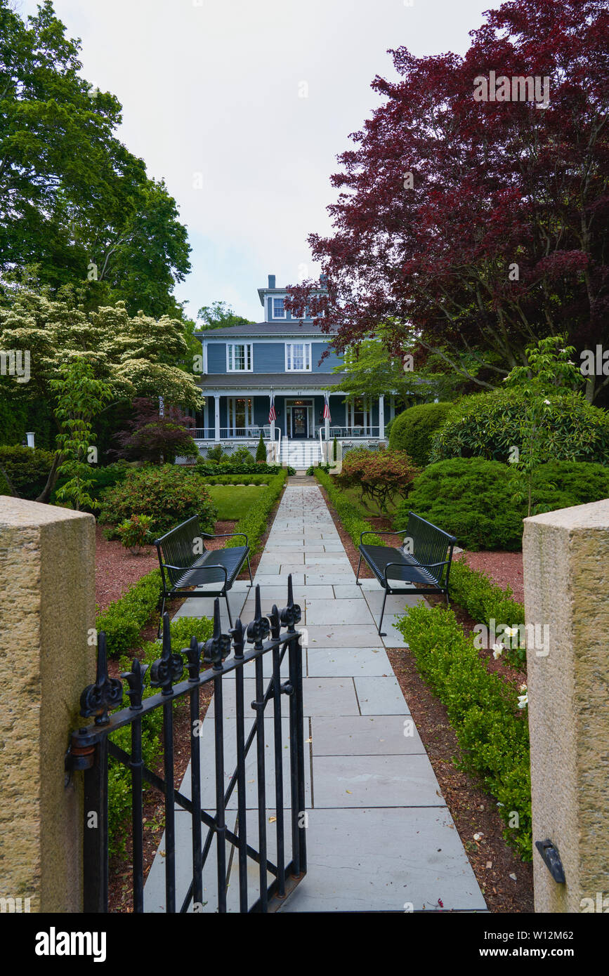 Falmouth, MA - June 14, 2019: The Captain's Manor Inn Bed and Breakfast seen from the sidewalk is a romantic getaway in the national registry historic Stock Photo