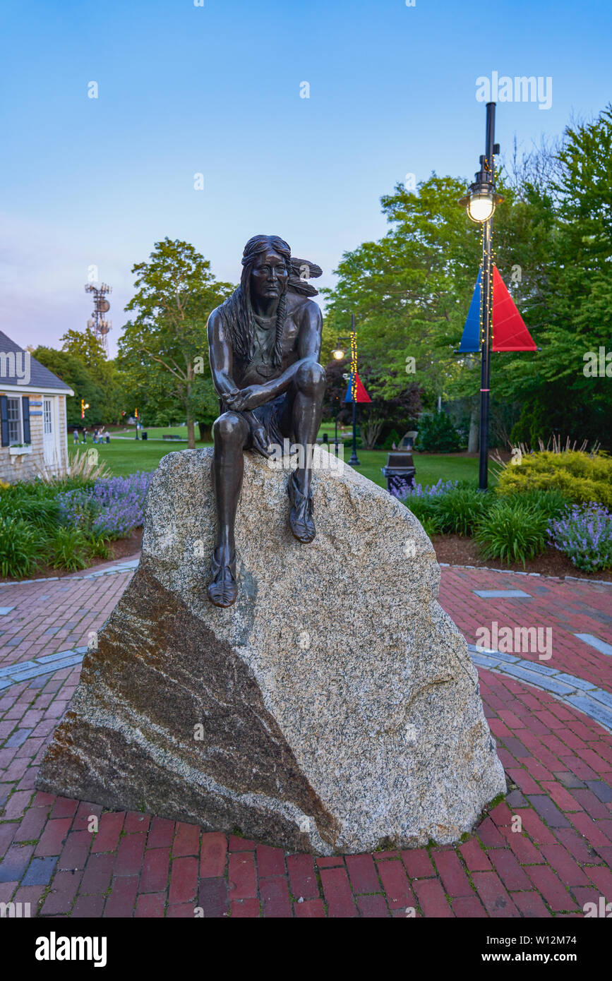 Hyannis, MA - June 12, 2019: Bronze statue by David Lewis of Wampanoag chieftan Sachem Iyanough who aided early settlers photographed at twilight. The Stock Photo