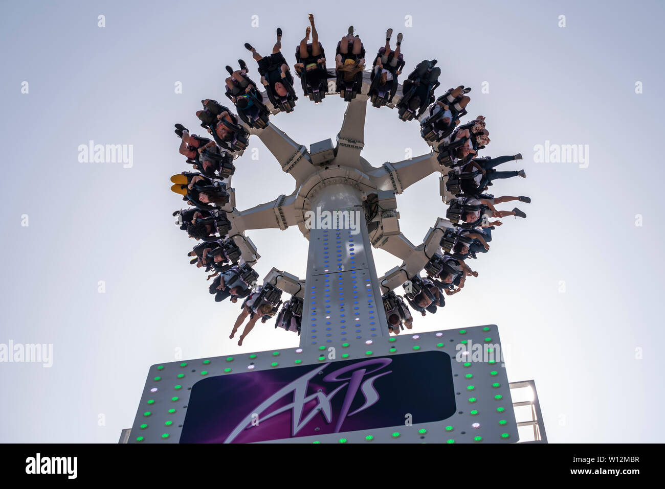 Thrill seekers ridding the new Axis ride at Adventure Island amusement park Western Esplanade, Southend on Sea, Essex, UK. Inverted riders Stock Photo