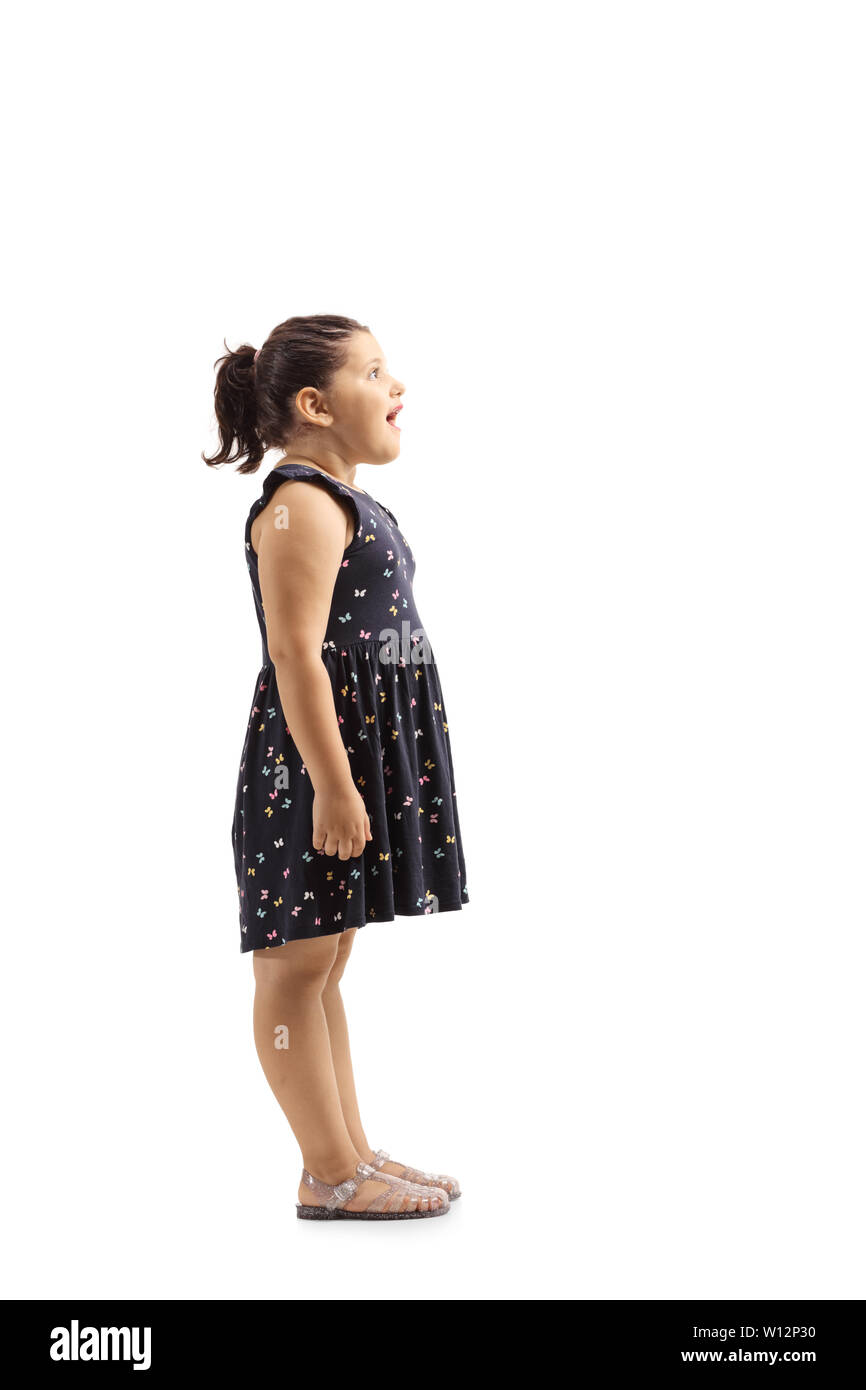 Full length profile shot of a surprised female child isolated on white background Stock Photo