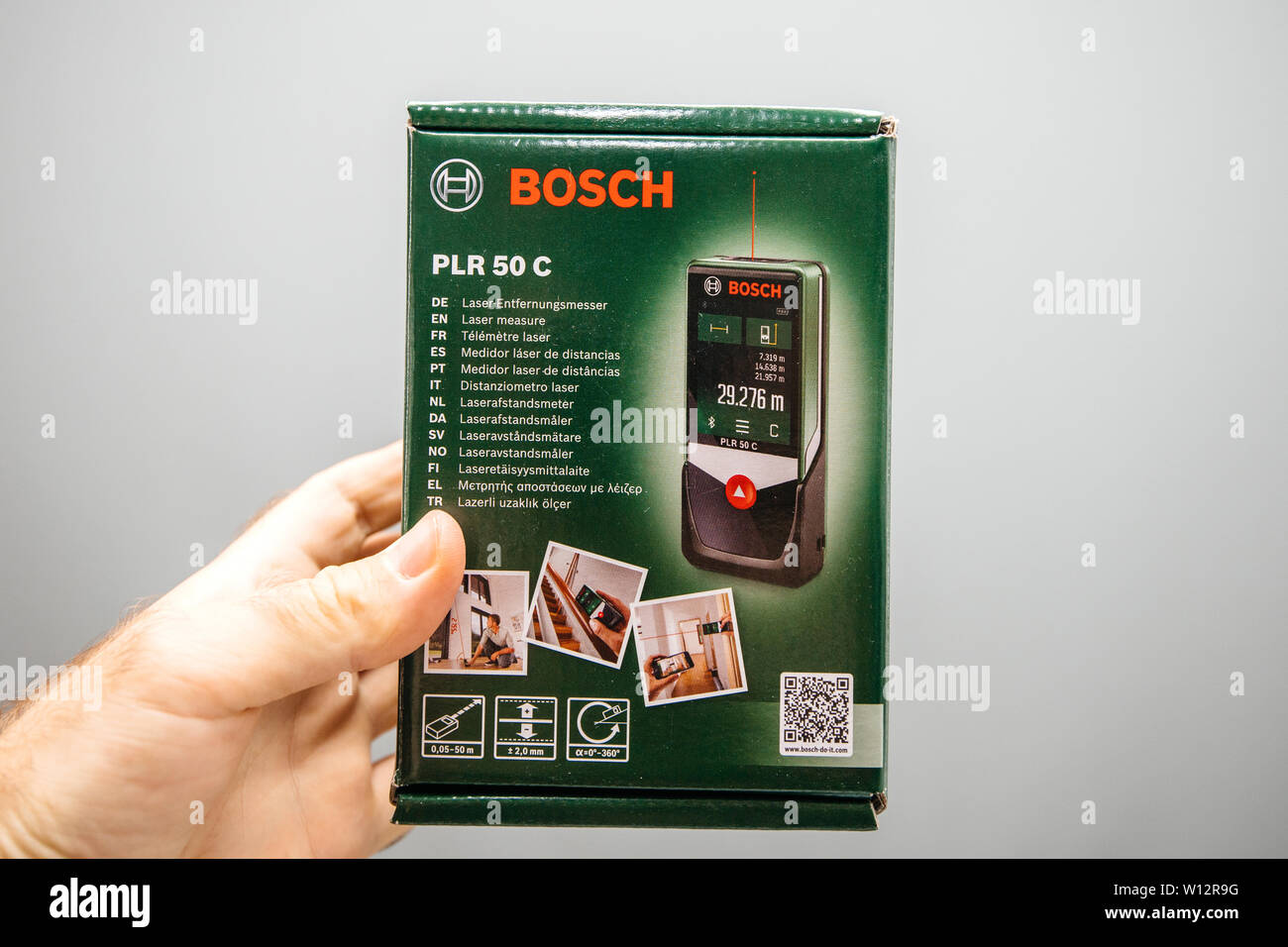 Paris, France - Jun 4, 2019: Man hand holding Bosch PLR 50 C laser measure  cardboard packaging box in hand Stock Photo - Alamy