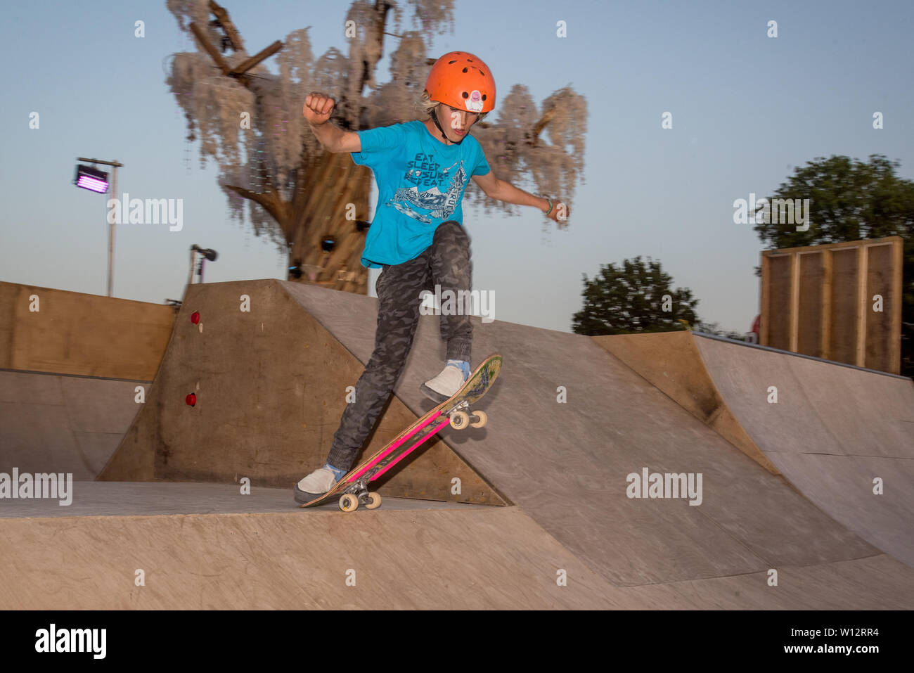 Glastonbury, Pilton, Somerset, UK. 28th June 2019. A young skateboarder at the ramp in Greenpeace Field of Glastonbury Festival on Friday June 2019. Credit: Perspective/Alamy Live News Stock Photo - Alamy