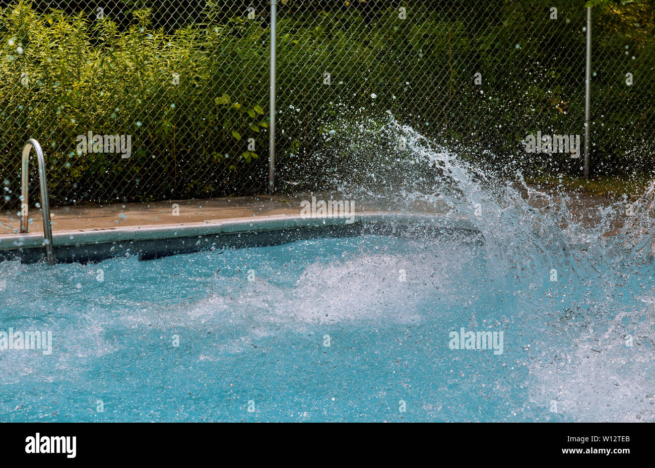 Beautiful splashing water in swimming pool in outdoor sunny day Stock ...