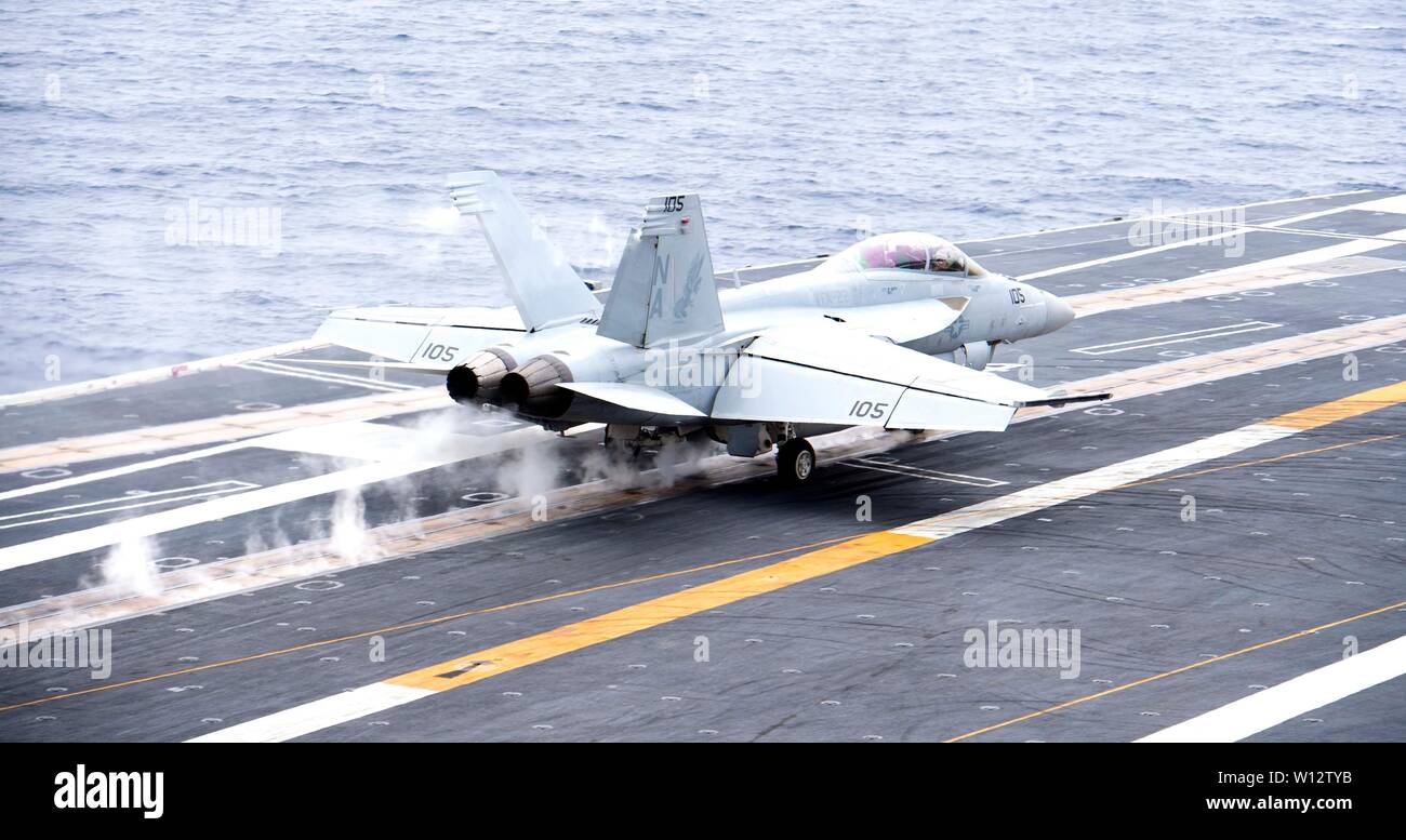 190627-N-HA101-0388 PACIFIC OCEAN (June 27, 2019) An F/A-18F Super Hornet assigned to the 'Fighting Redcocks' of Strike Fighter Squadron (VFA) 22, launches off the flight deck of the aircraft carrier USS Nimitz (CVN 68). Nimitz is currently underway conducting routine operations. (U.S. Navy photo by Mass Communication Specialist 3rd Class Jessica Tukes) Stock Photo