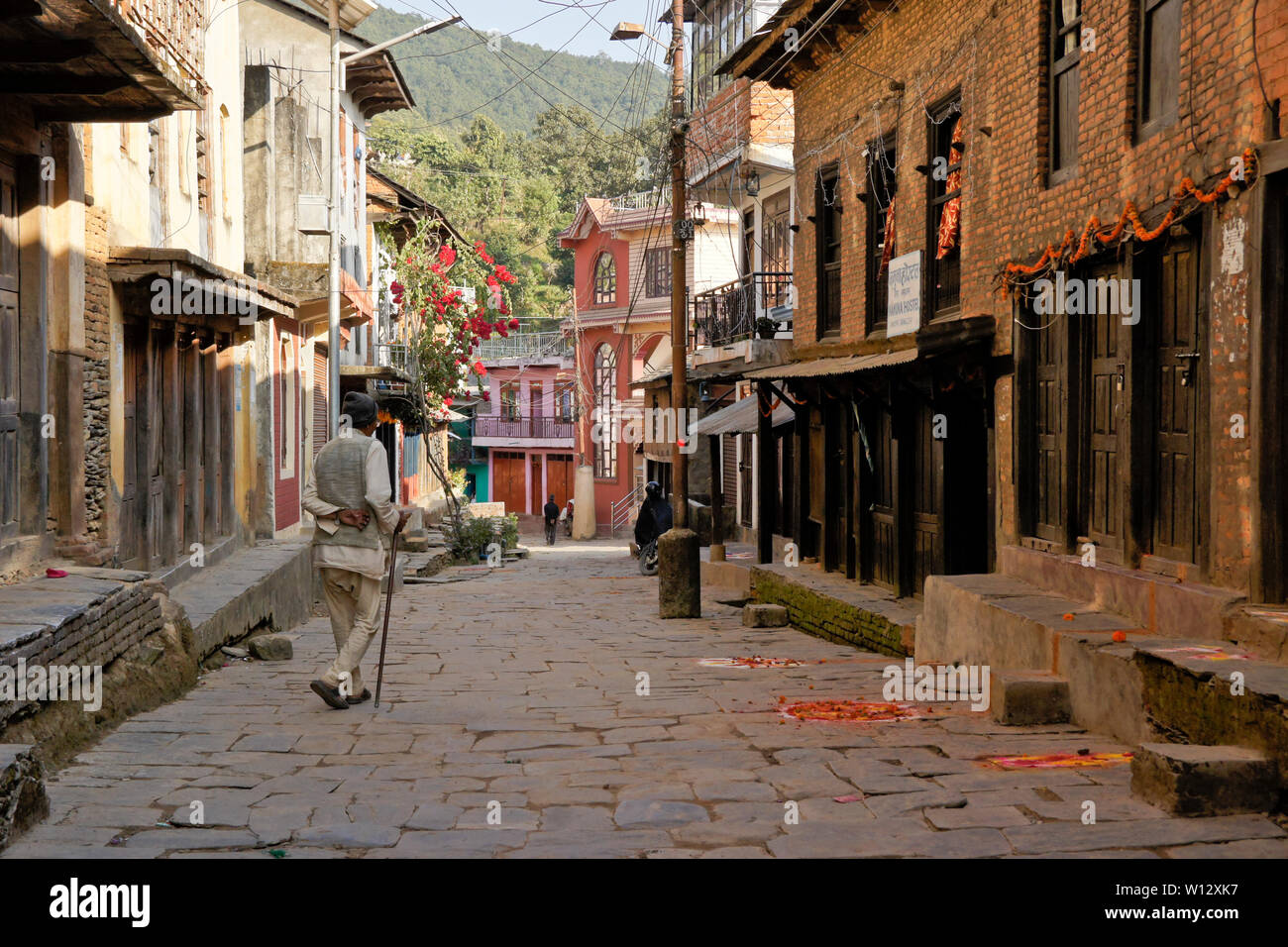Buildings along old stone street in historic Newari trading post town of Bandipur, Tanahan District, Nepal Stock Photo