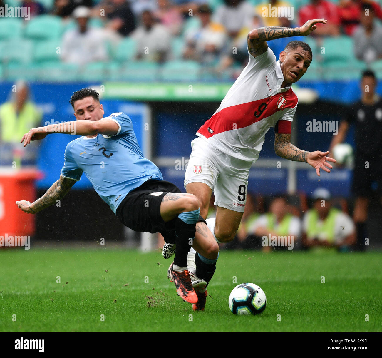 Salvador, Brazil. 29th June, 2019. Uruguay's Jose Maria Gimenez (L) competes with Paolo Guerrero of Peru during the Copa America 2019 quarterfinal match between Uruguay and Peru in Salvador, Brazil, June 29, 2019. Peru won 5-4 in penalty shoot-out. Credit: Xin Yuewei/Xinhua/Alamy Live News Stock Photo