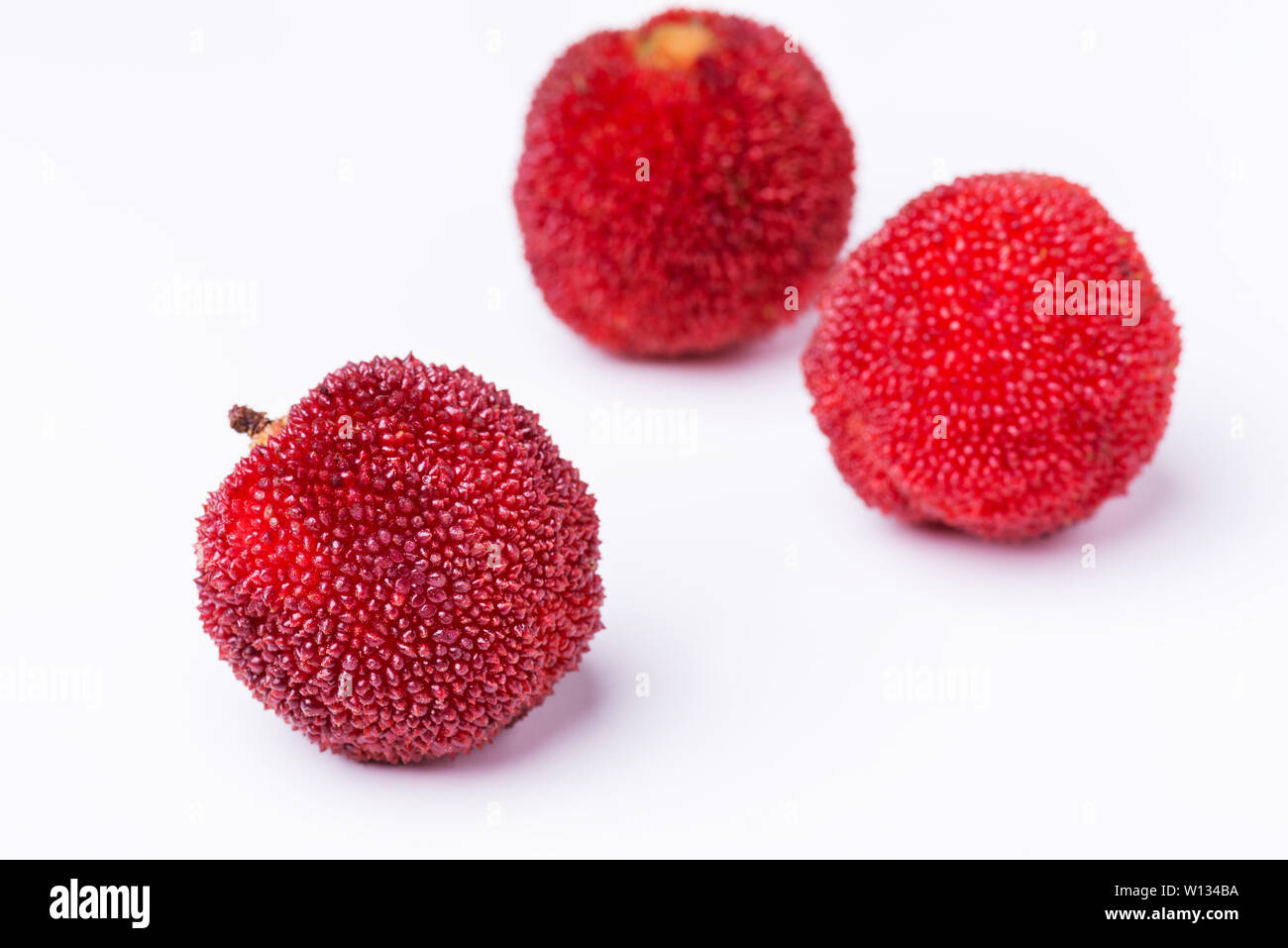 red and ripe waxberry under white background Stock Photo