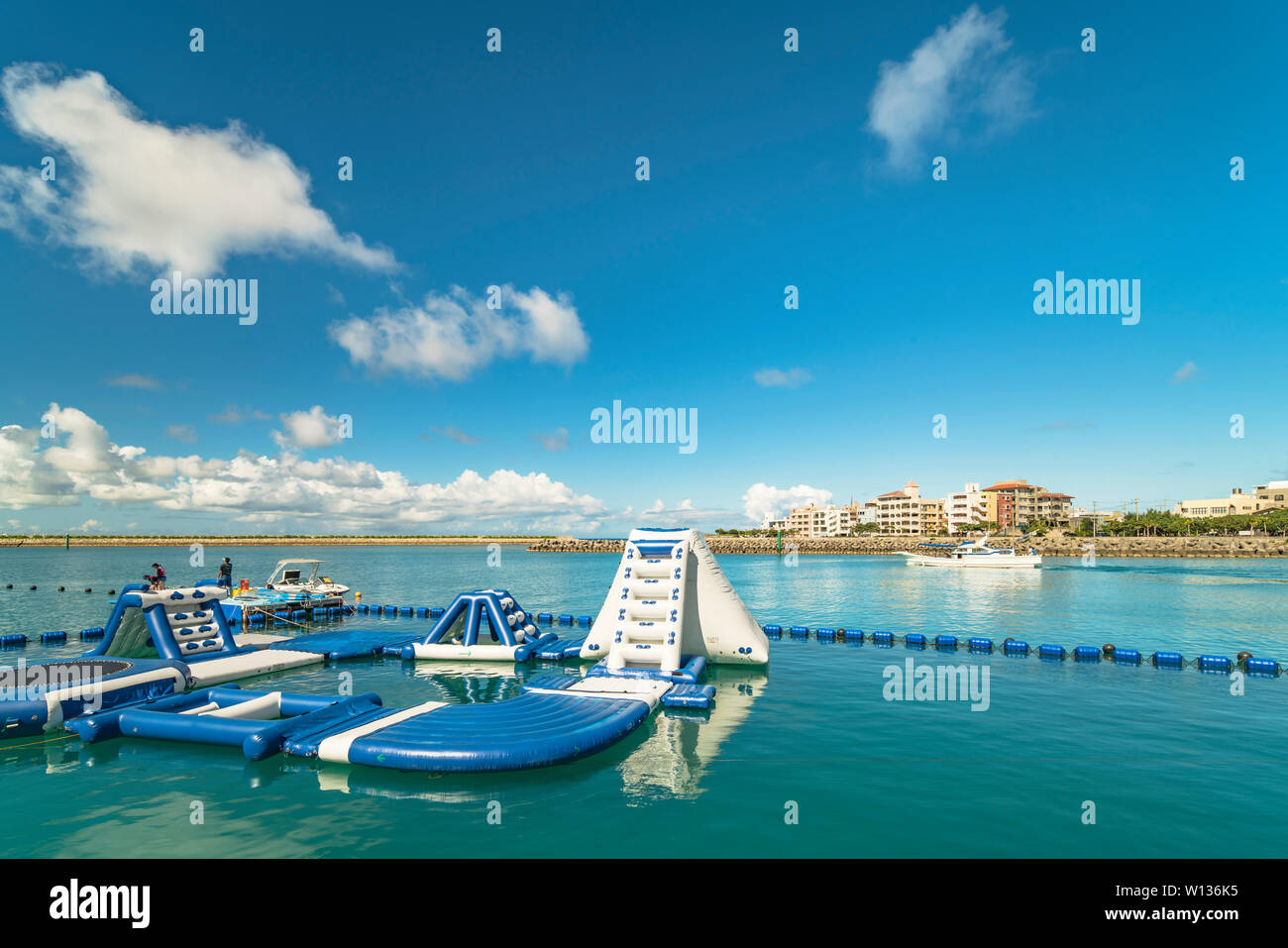 Inflatable slide for water sports, jet ski and motor boating in the