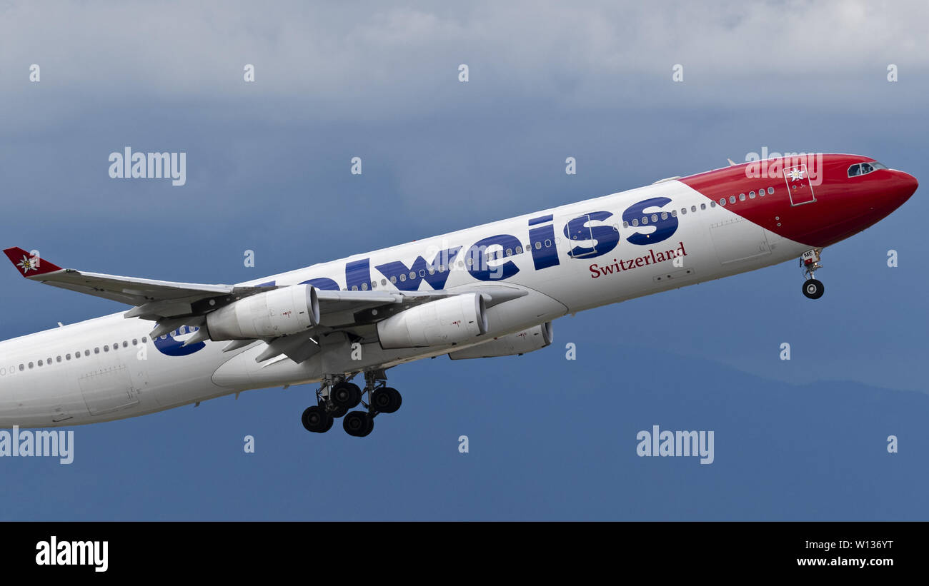 Richmond, British Columbia, Canada. 27th June, 2019. An Edelweiss Air Airbus A340-313X (HB-JME) wide-body jet airliner airborne after take-off. The Swiss leisure airline is wholly owned by Swiss International Air Lines, part of the Lufthansa Group. Credit: Bayne Stanley/ZUMA Wire/Alamy Live News Stock Photo