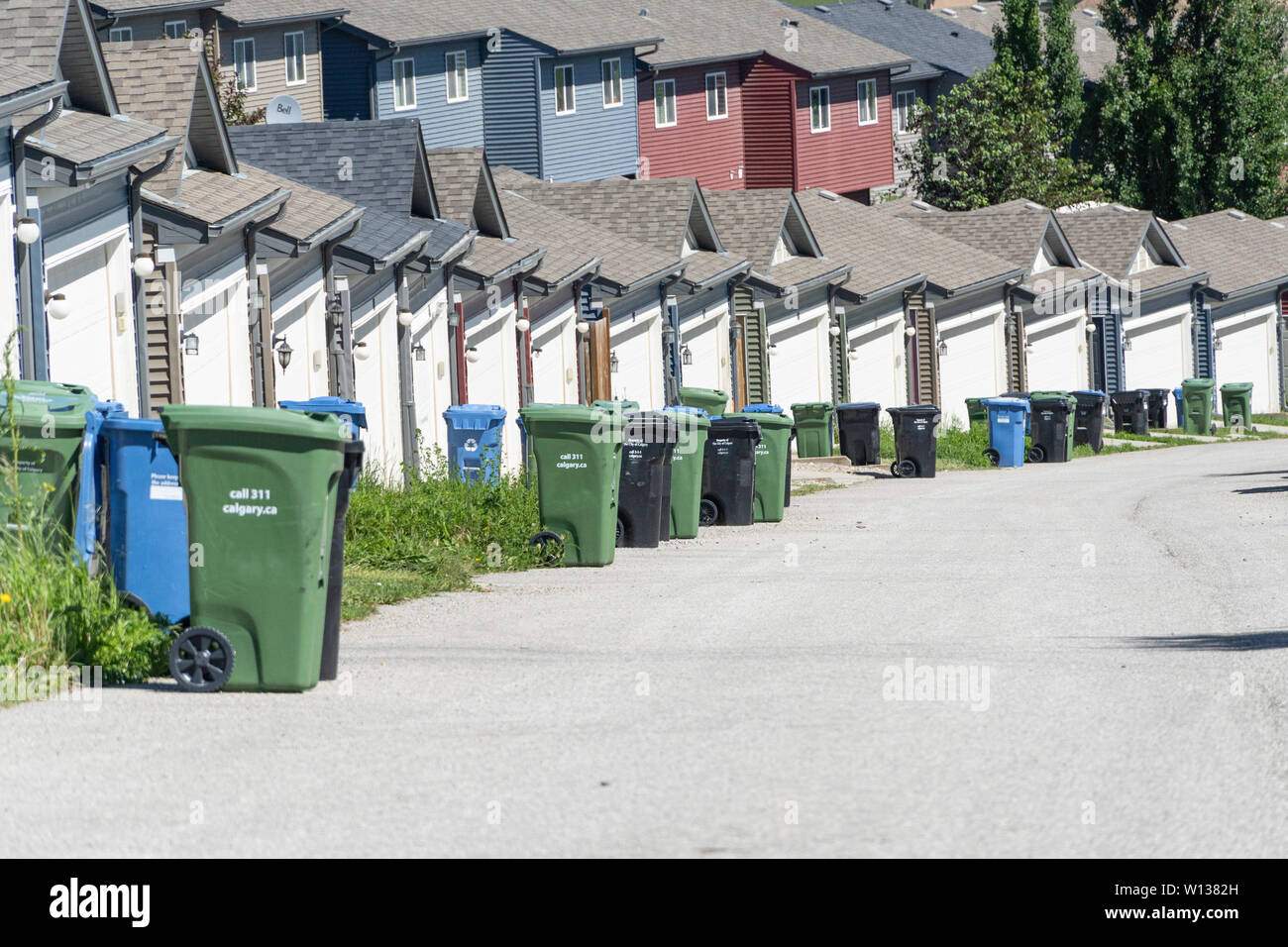 June 29 2019 Calgary, Alberta, Canada Garbage bins lined up on