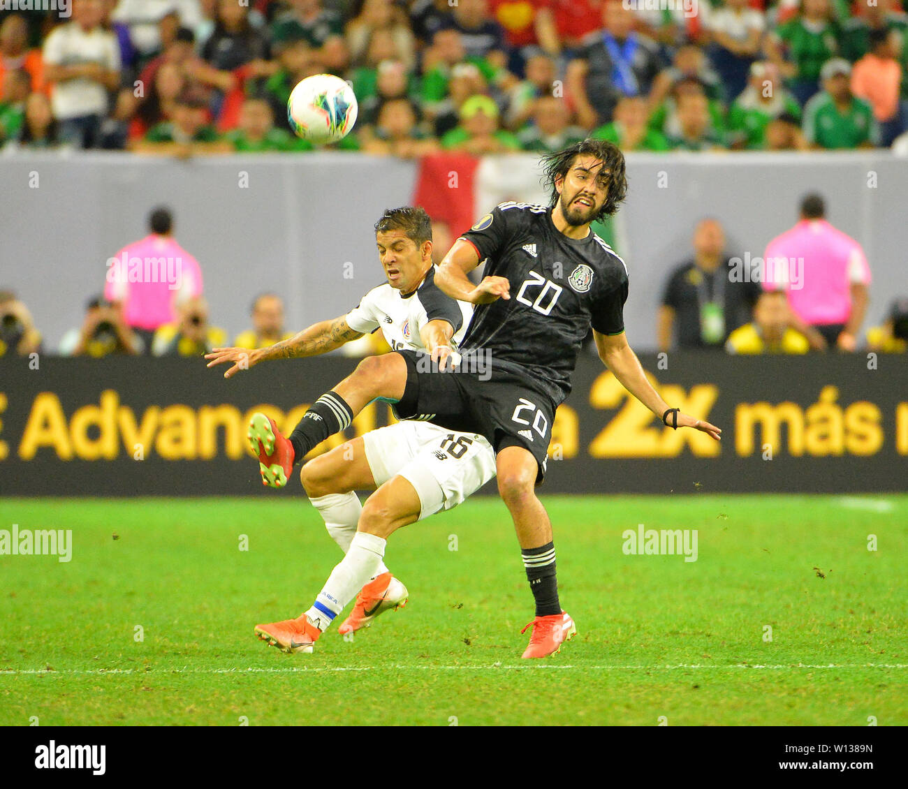 Houston, TX, USA. 29th June, 2019. Mexico forward, Rodolfo Pizarro (20), and Costa Rica defender, Christian Gamboa (16), work to bring the ball under control during the 2019 CONCACAF Gold Cup, quarter final match between Mexico and Costa Rica, at NRG Stadium in Houston, TX. Mandatory Credit: Kevin Langley/Sports South Media/CSM/Alamy Live News Stock Photo