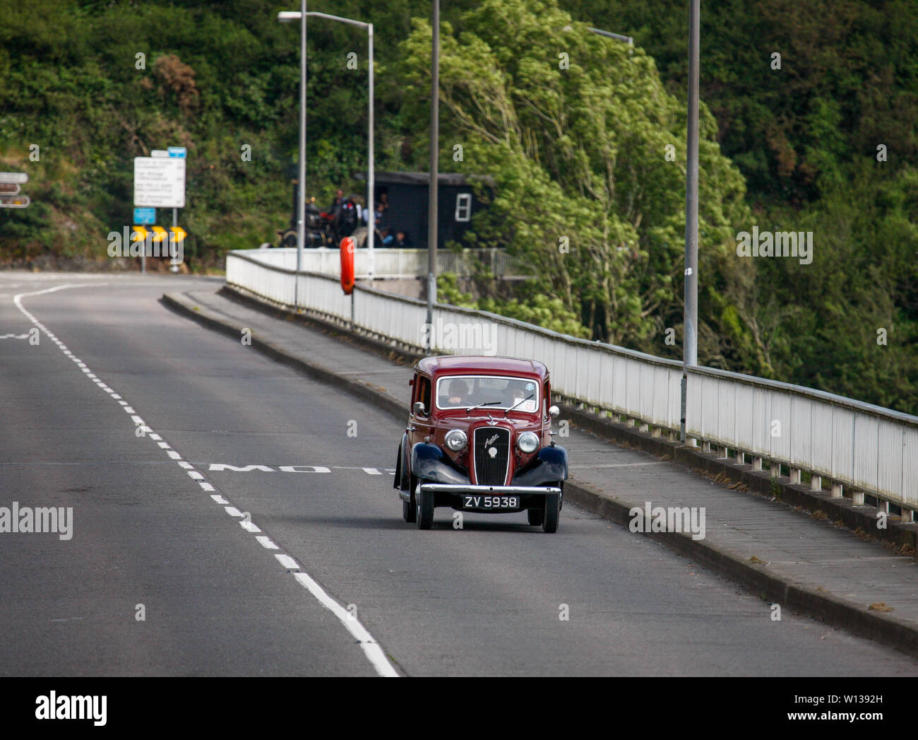 Kinsale, Cork, Ireland. 29th June, 2019. A 1936 Austin 10 Cambridge driven by Michael Murphy passes over the Bridge in Kinsale  Co. Cork as part of a three day road run of steam engines from Baltimore to Kinsale to raise funds for the RNLI. Credit: David Creedon/Alamy Live News Stock Photo