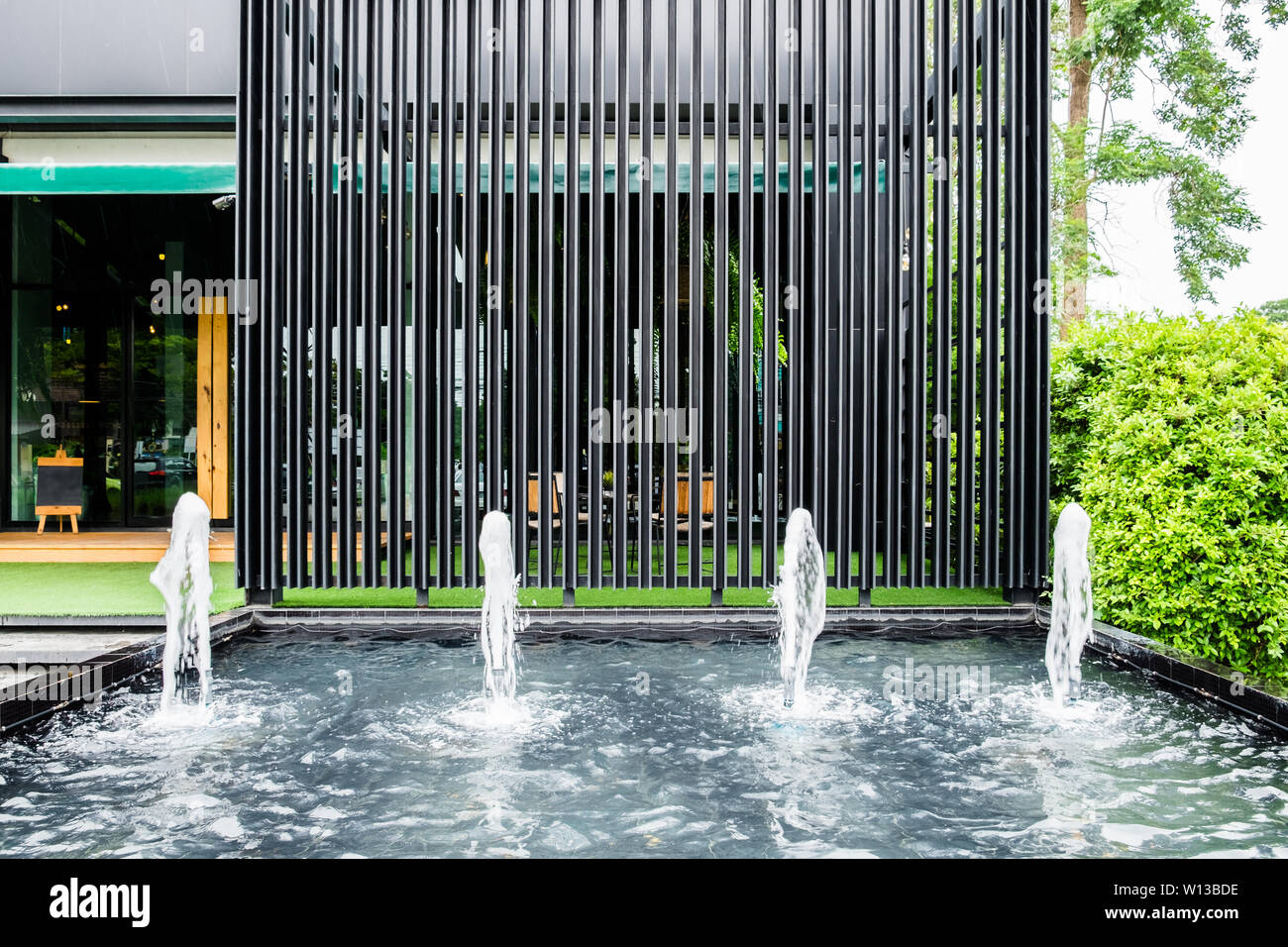 Front shop fountain with black steel panel decorate luxury modern Stock Photo