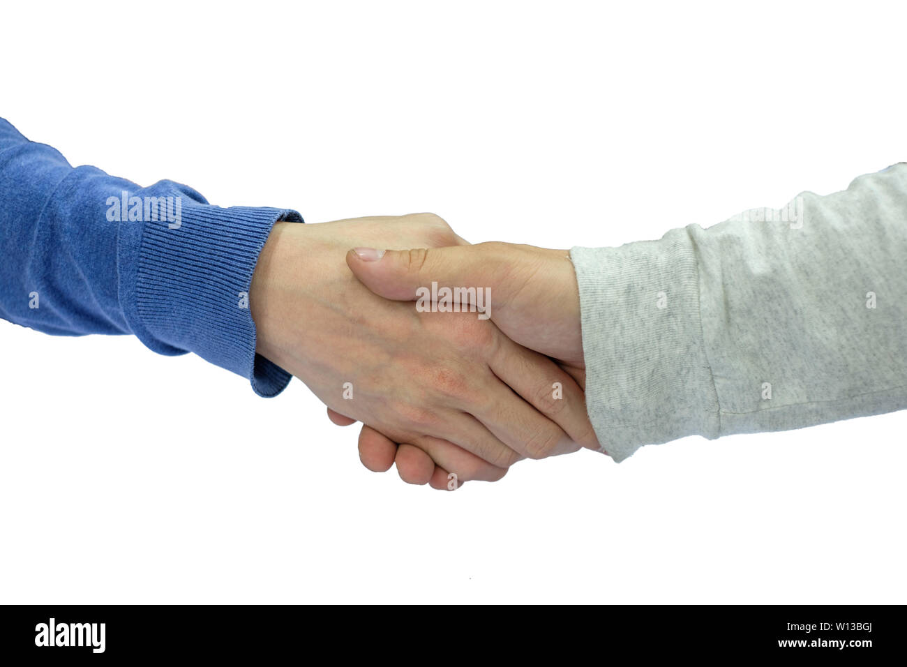 Young man hand casual shaking hands on isolated white background Stock Photo