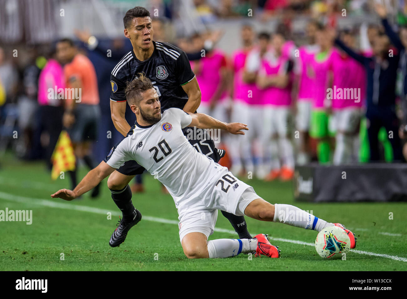 June 29, 2019: Costa Rica midfielder Elias Aguilar (20) keeps the ball in bounds in front of Mexico defender Hector Moreno (15) during the extra time period of a CONCACAF Gold Cup quarterfinals soccer match between Costa Rica and Mexico at NRG Stadium in Houston, TX. Mexico won on penalty kicks 1-1 (5-4).Trask Smith/CSM Stock Photo