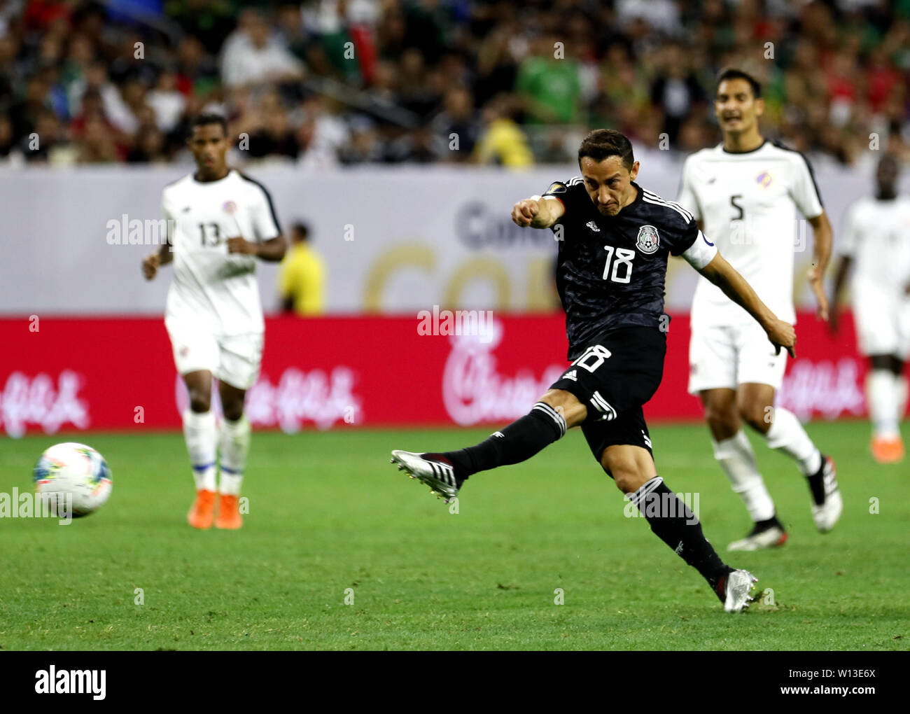 (190630) -- HOUSTON, JUNE 30, 2019 (Xinhua) Mexico's Andres Guardado (Front) shoots during the CONCACAF Gold Cup soccer tournament quarterfinal between Mexico and Costa Rica at NRG Stadium in Houston, Texas, the United States on June 29, 2019.  The match ended 1-1 through extra time.  Mexico beat Costa Rica 5-4 in a penalty shootout. (Xinhua/Song Qiong) Stock Photo