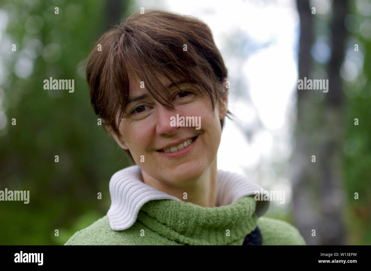 Happy woman smiling outdoors in hi-res stock photography and images - Alamy