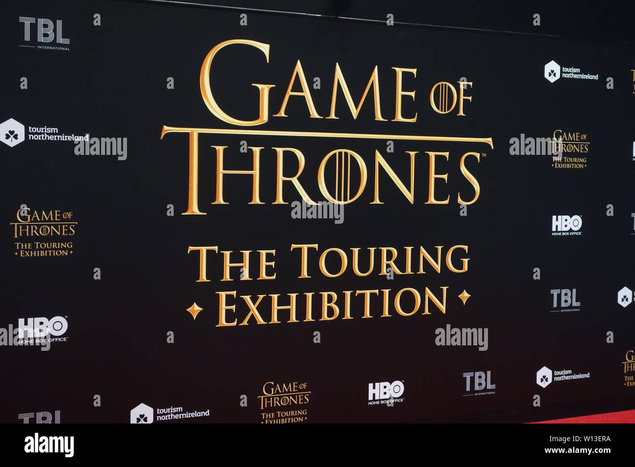 Red Carpet Media Wall Backdrop on Display in the Game of Thrones Touring Exhibition, Belfast, County Antrim, Northern Ireland, UK. Stock Photo