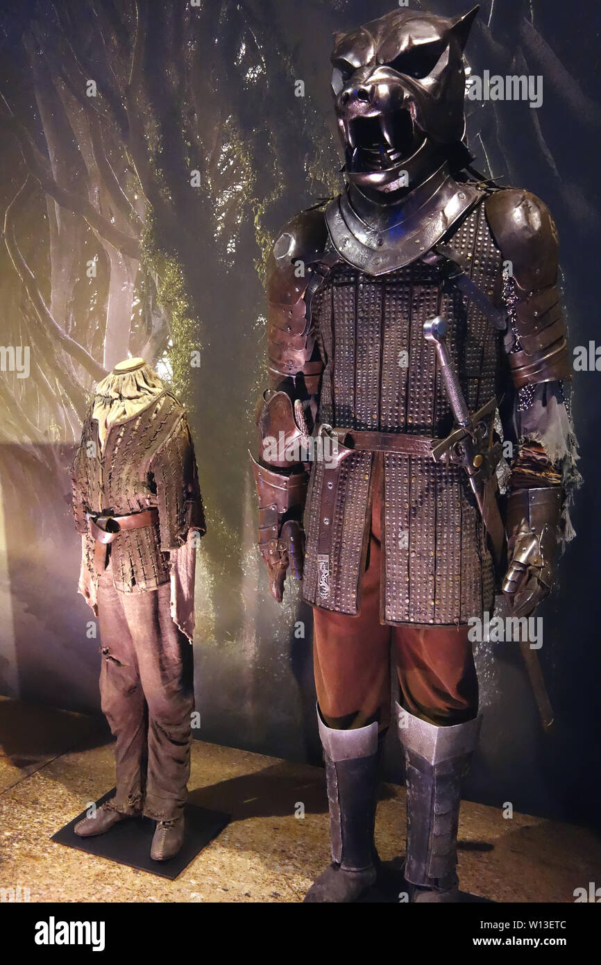 Costumes worn by Arya Stark & Sandor Clegane 'The Hound' on Display in the Game of Thrones Exhibition, Belfast, County Antrim, Northern Ireland, UK. Stock Photo