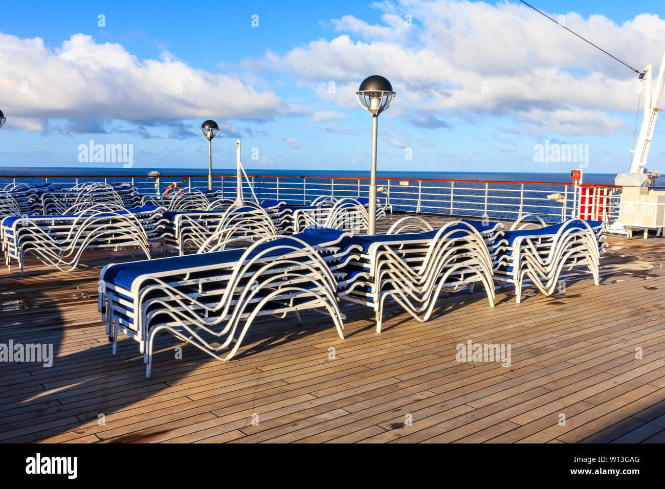 Sunbeds on a teak deck of a cruise ship in the South Pacific Stock ...