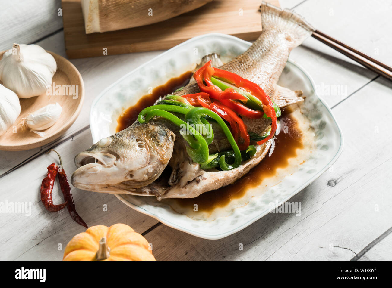 Steamed sea bass, traditional Cantonese cuisine Stock Photo Alamy