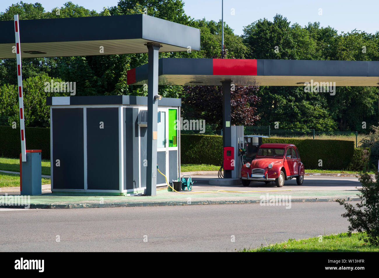 A car stopped at a gas station to pick up gas Stock Photo Alamy