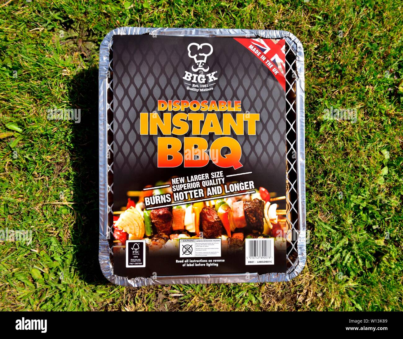 Disposable instant BBQ foil tray on a grass background Stock Photo Alamy