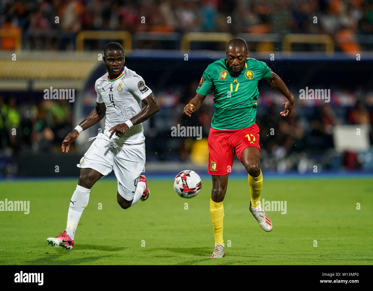 Ismailia, Egypt. 29th June, 2019. Karl Brillant Toko Ekambi of Cameroon and Jonathan Mensah of Ghana during the 2019 African Cup of Nations match between Benin and Guinea-Bissau at the Ismailia stadium in Ismailia, Egypt. Ulrik Pedersen/CSM/Alamy Live News Stock Photo