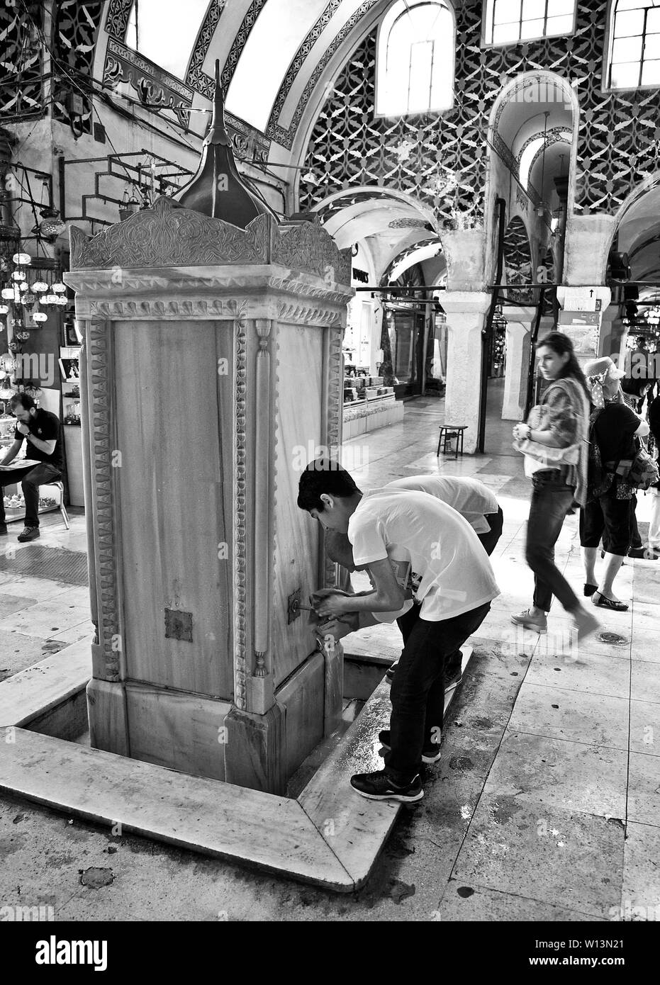 Boys at fountain in Grand Bazaar, Istanbul Stock Photo