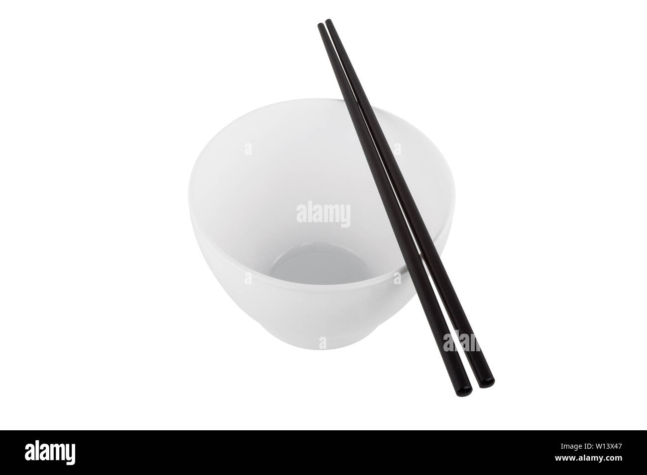White bowl with chopsticks isolated on white background Stock Photo