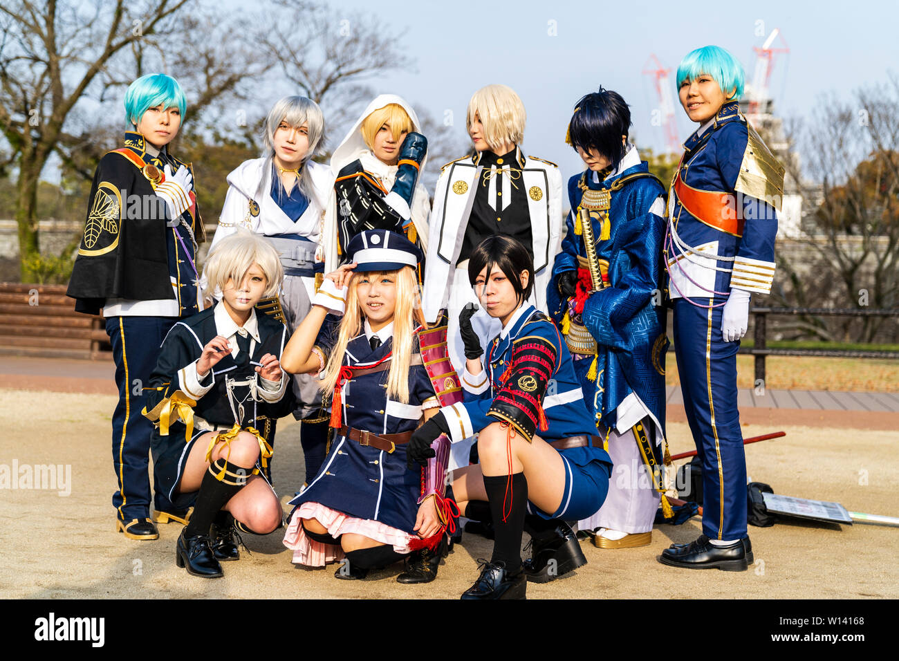 Japanese cos play event at Kumamoto Castle Park. Group of costume woman players in Science fiction type uniforms gathered together for a group shot. Stock Photo