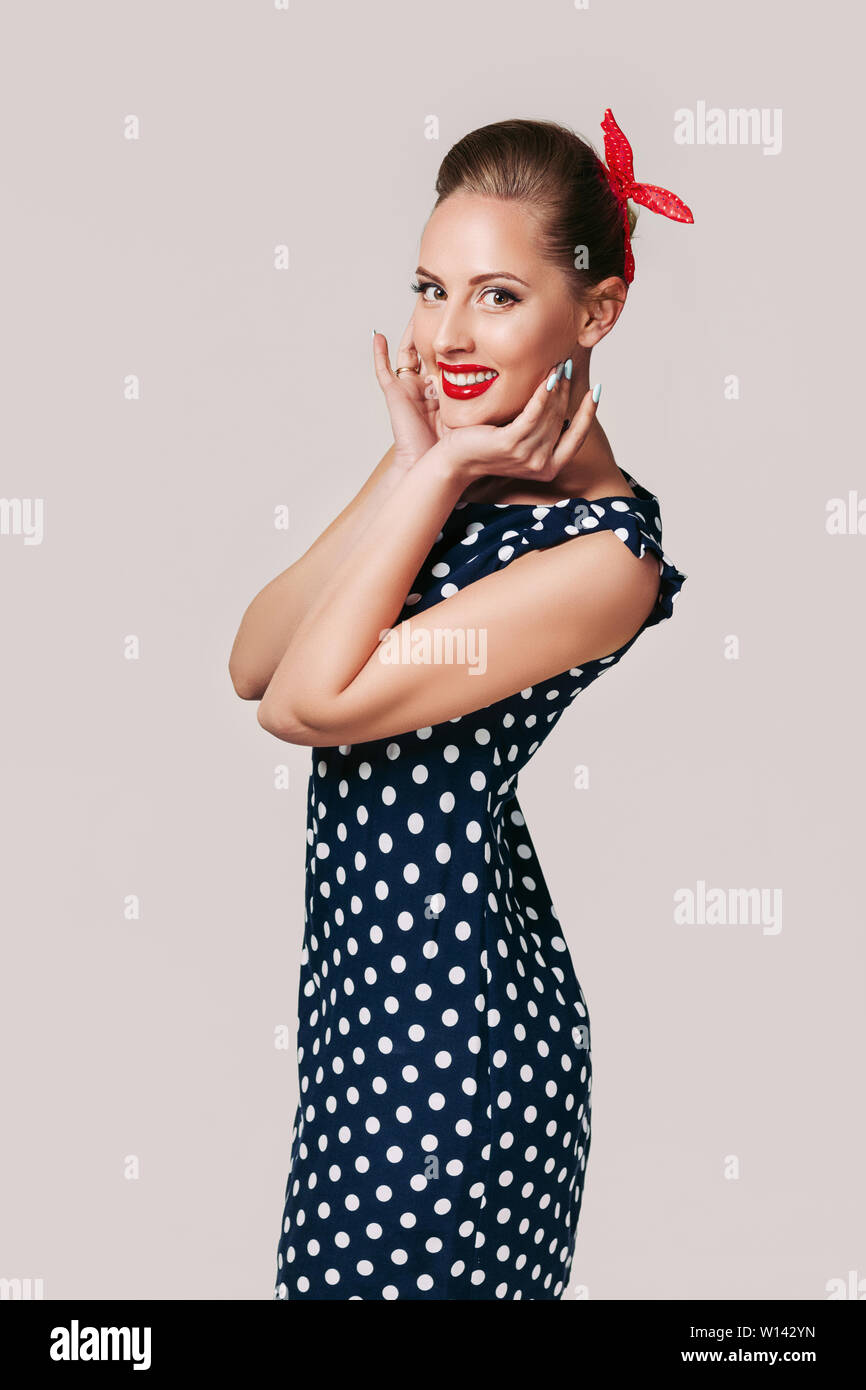 portrait of smiling pin up woman in polka dot dress. cute girl in retro  style Stock Photo - Alamy