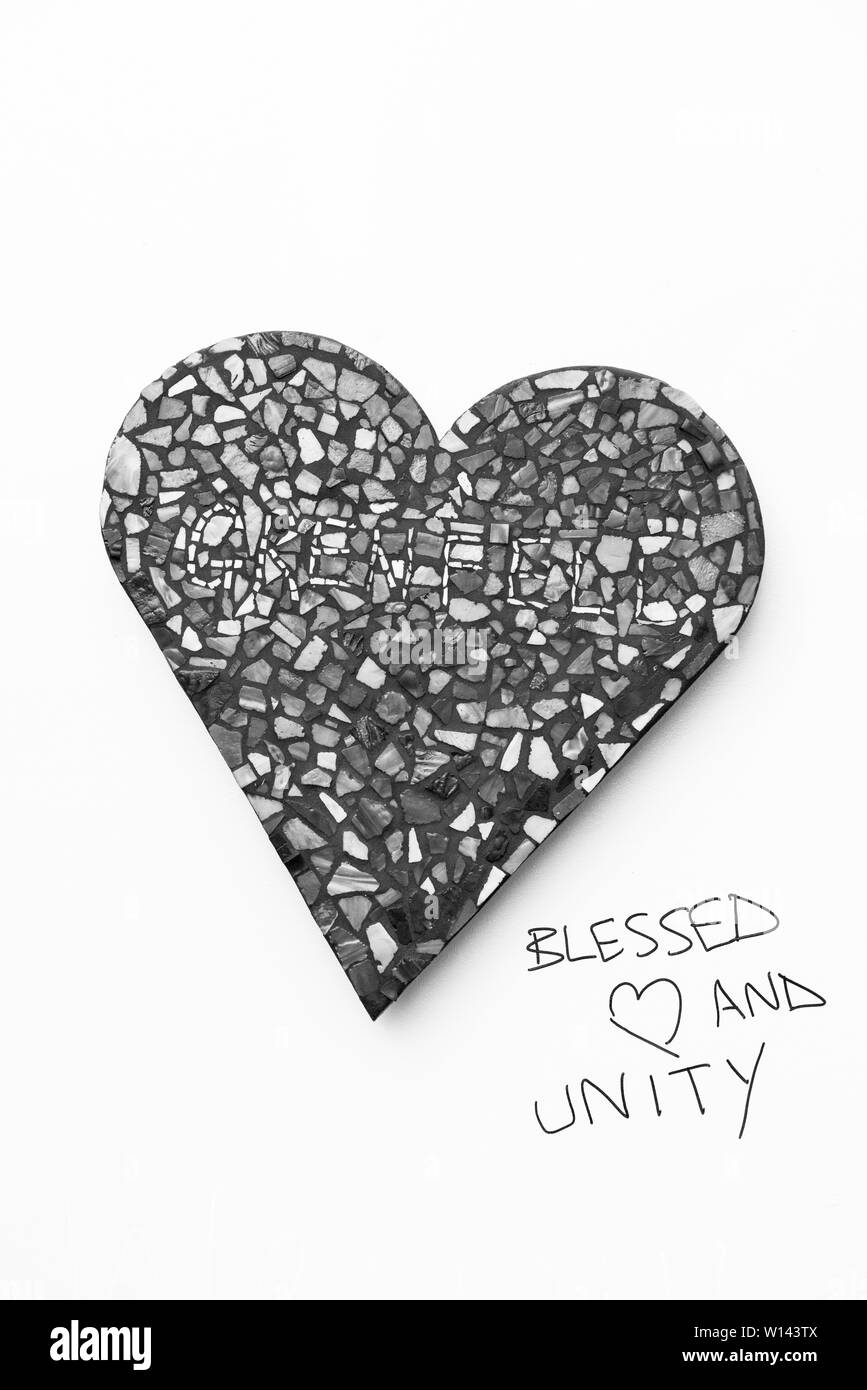 Mosaics form part of the commemorative wall at Grenfell Tower, Kensington, London. Black and white Stock Photo