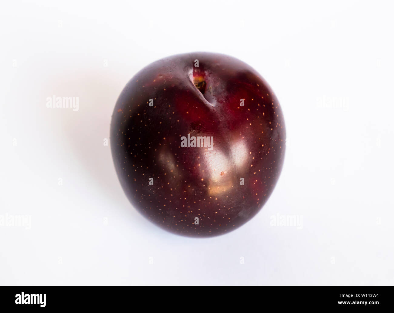 close up of a red cherry plum isolated on white background. ripe red cherry plum. Stock Photo