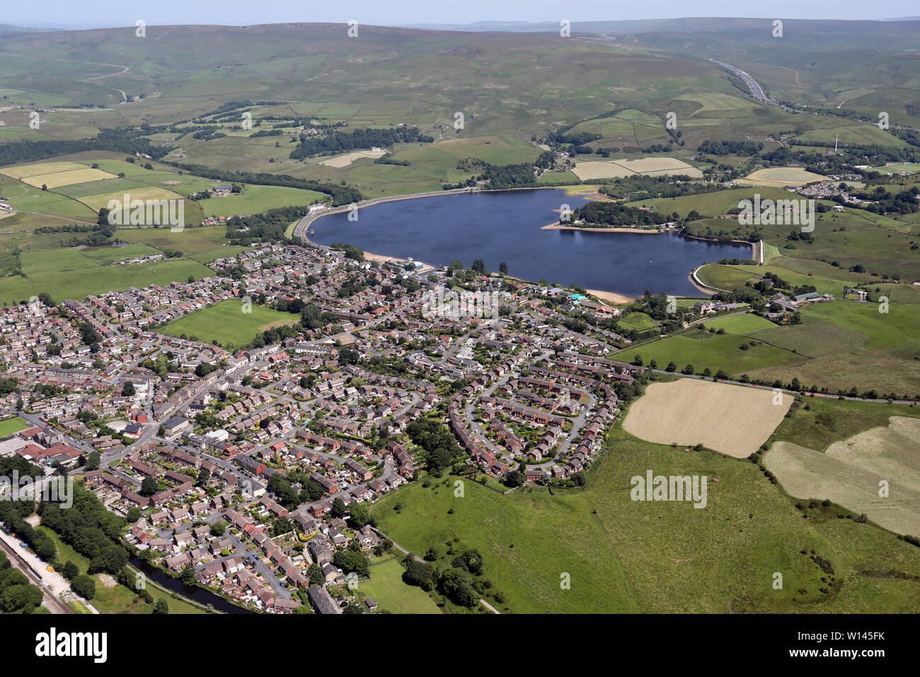 aerial view of Smithybridge, Littleborough, with Hollingworth Lake in the background, UK Stock Photo