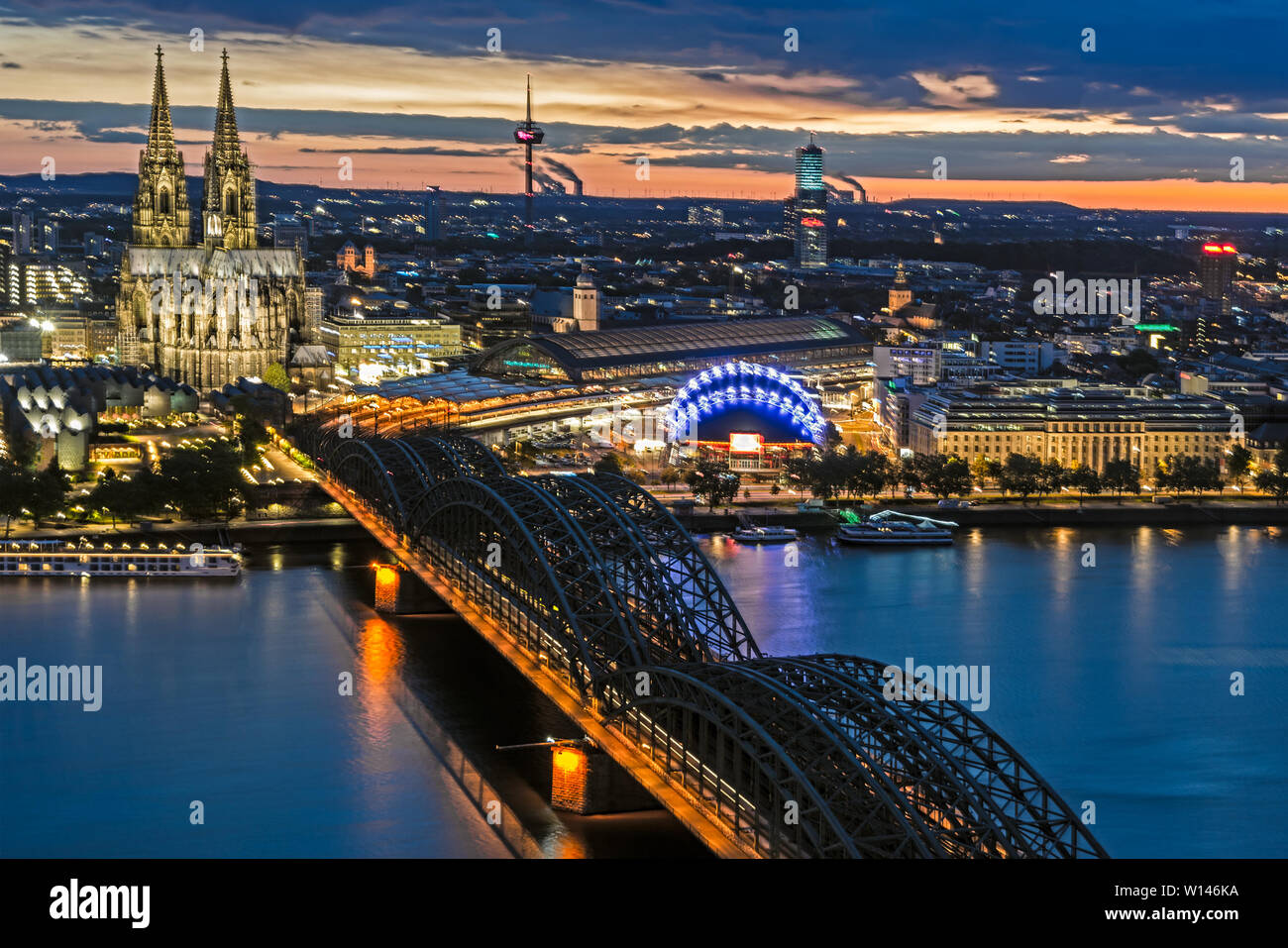 COLOGNE, GERMANY - MAY 12: Night cityscape of Cologne, Germany on May 12, 2019. View from Triangle tower to the cathedral and Hohenzolern Bridge. Stock Photo