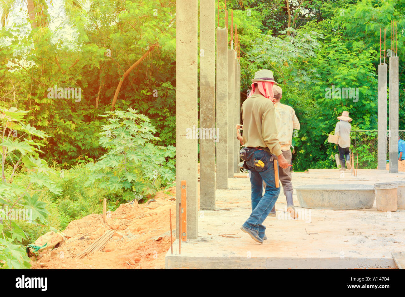 construction workers collaborating in the installation formwork workplace build a house Stock Photo