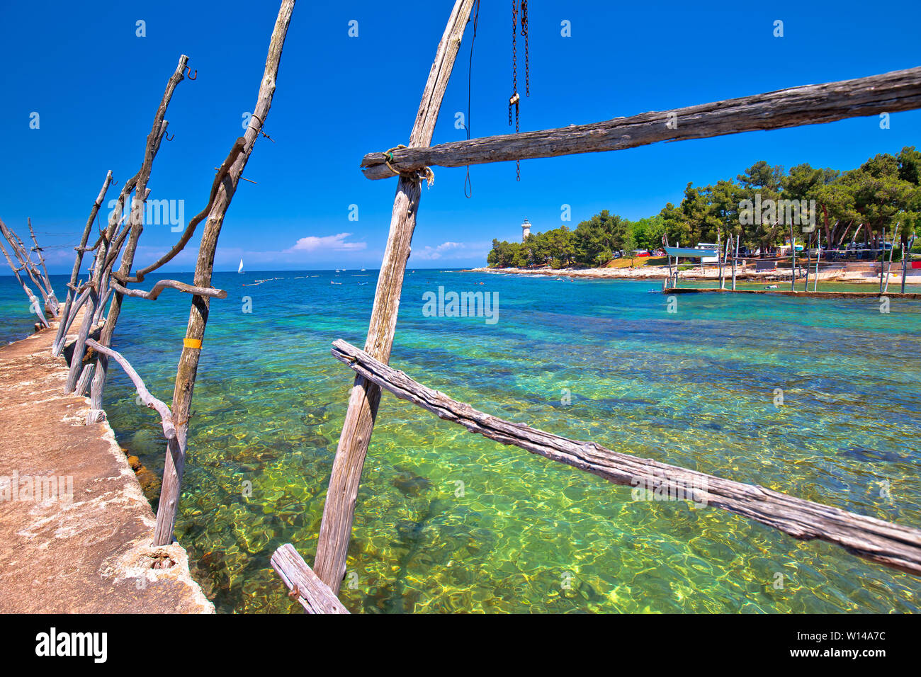 Savudrija turquoise beach and wooden boat holders view, Istria regin of Croatia Stock Photo