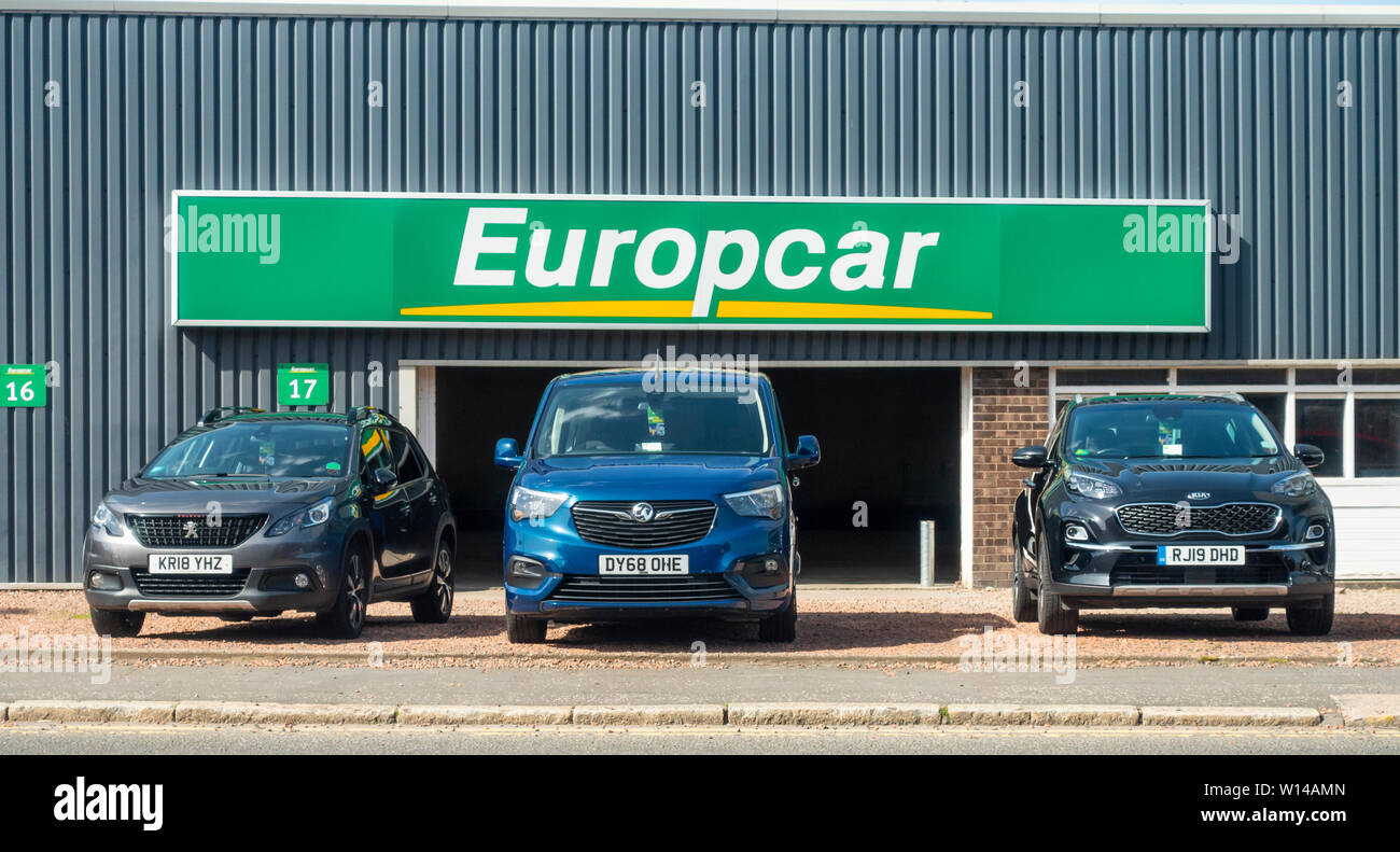 Three rental cars ready for hire outside the Europcar Glasgow City depot, Lancefield Quay.  Scotland Stock Photo