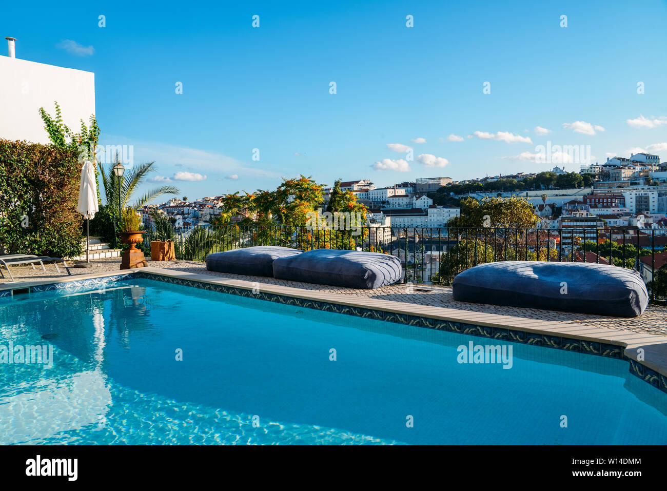 Swimming pool on roof top with beautiful city of Lisbon, Portugal. Stock Photo