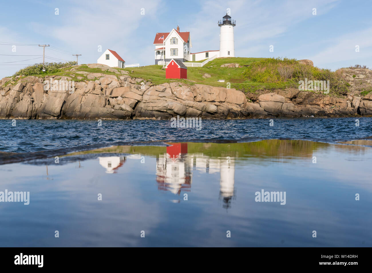 Reflection of Historic Nubble Lighthouse on Cape Neddick in York, Maine Stock Photo
