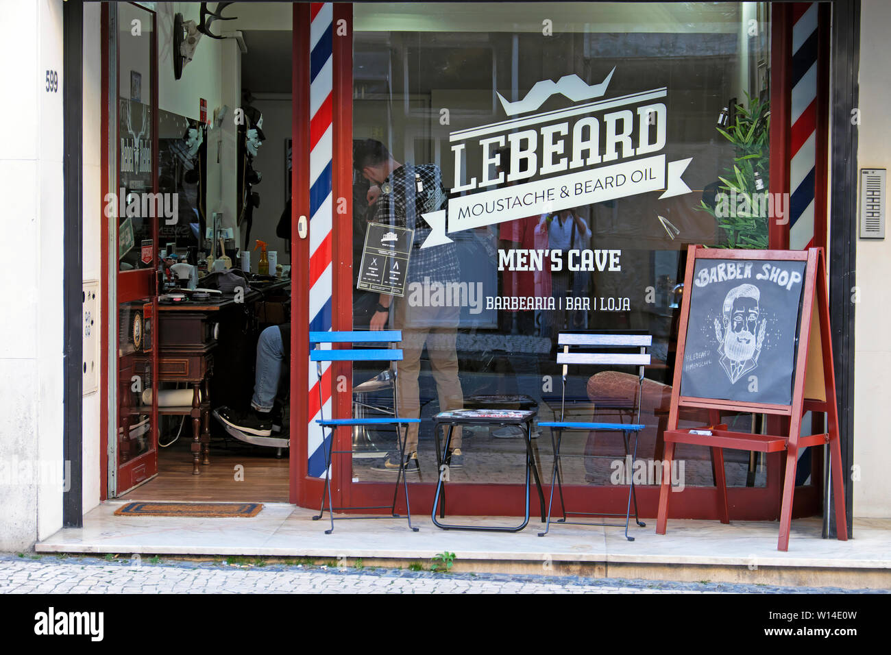 Barber Shop LeBeard outside view of hipster storefront and window graphics signs on Rua de Cedofeita in Porto Portugal Europe  KATHY DEWITT Stock Photo