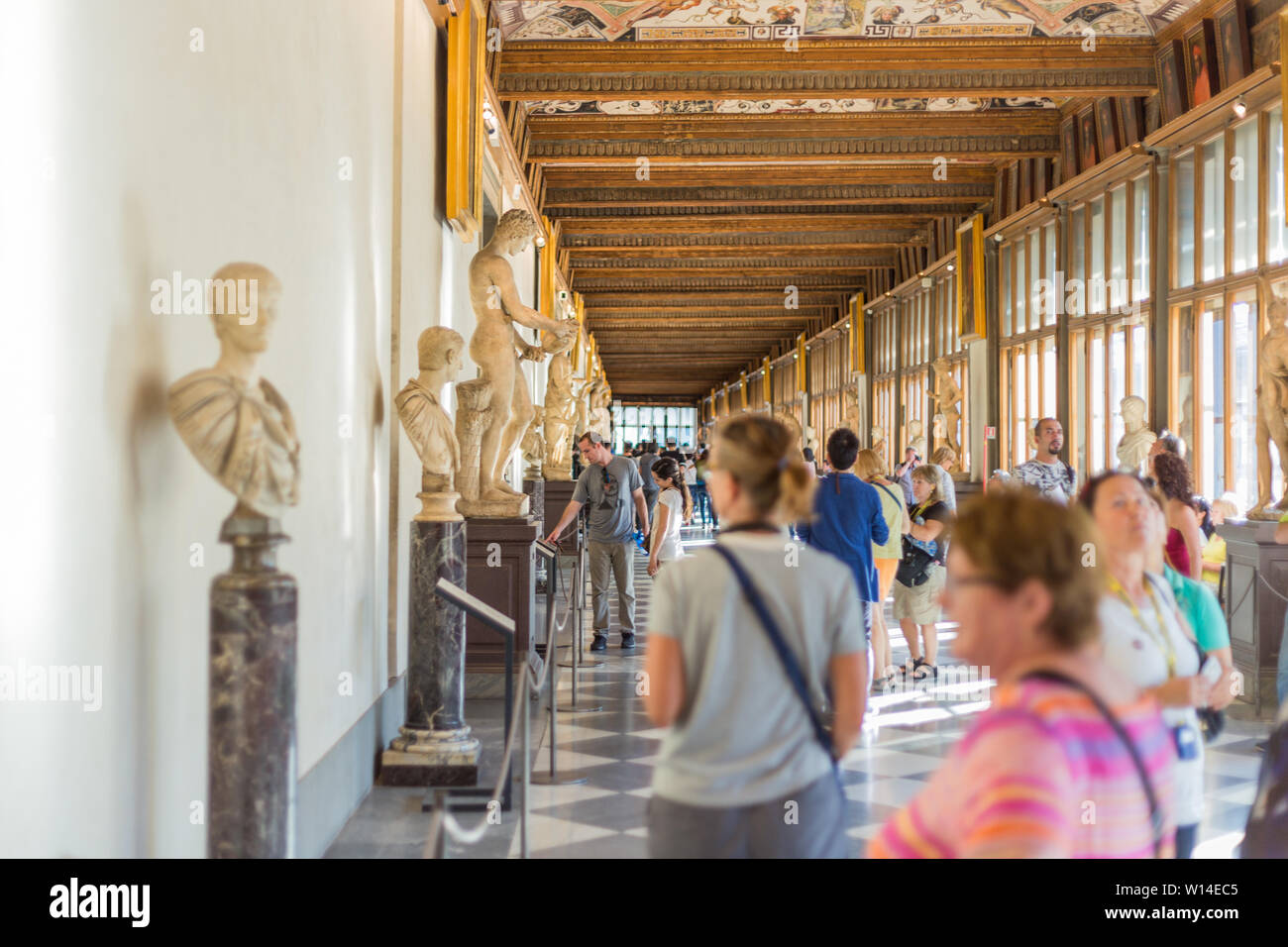 Florence, Italy September 25, 2016 Tourists in hallway of Uffizi Gallery, one of the oldest