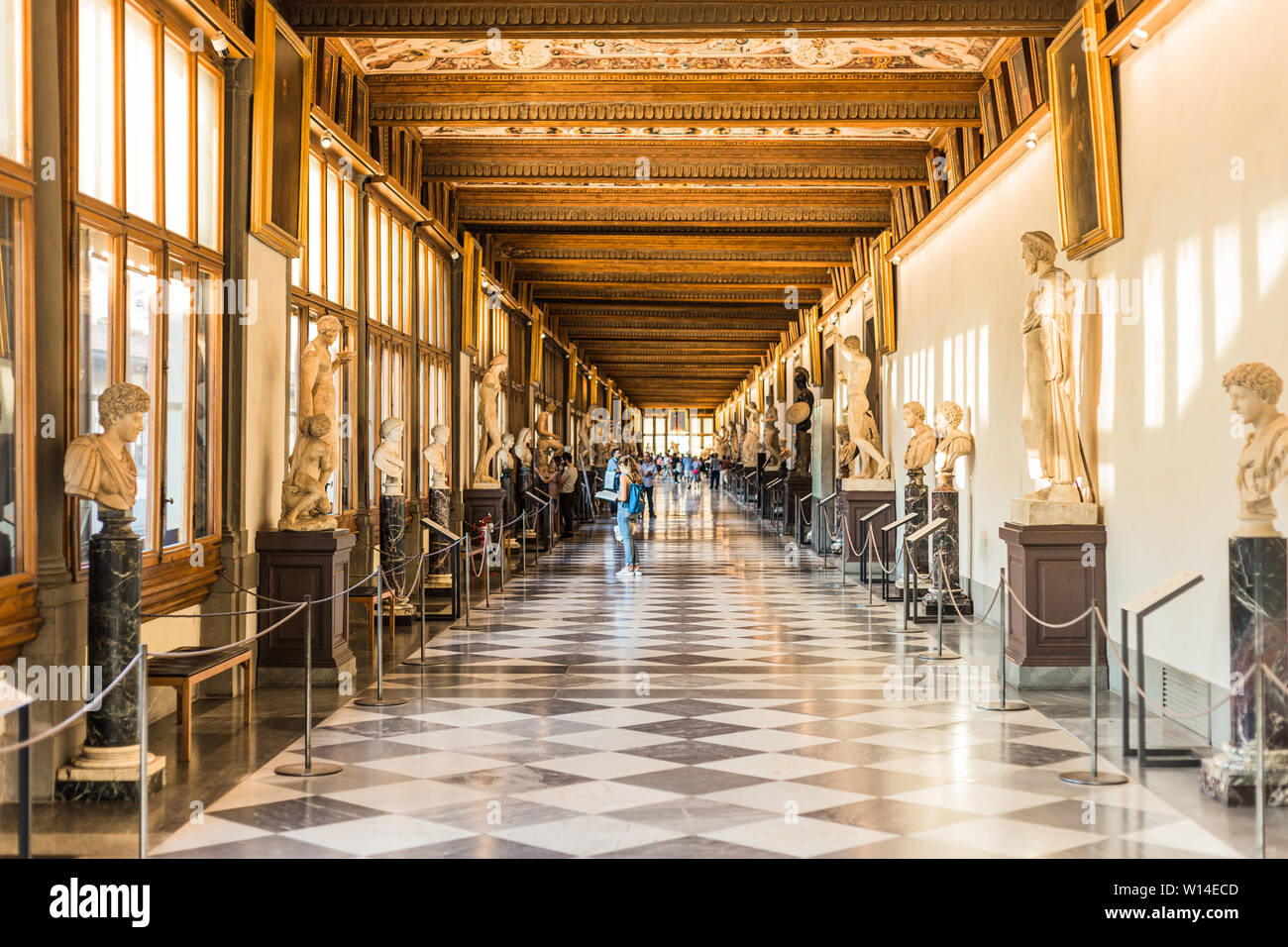 Florence, Italy September 25, 2016 Tourists in hallway of Uffizi Gallery, one of the oldest
