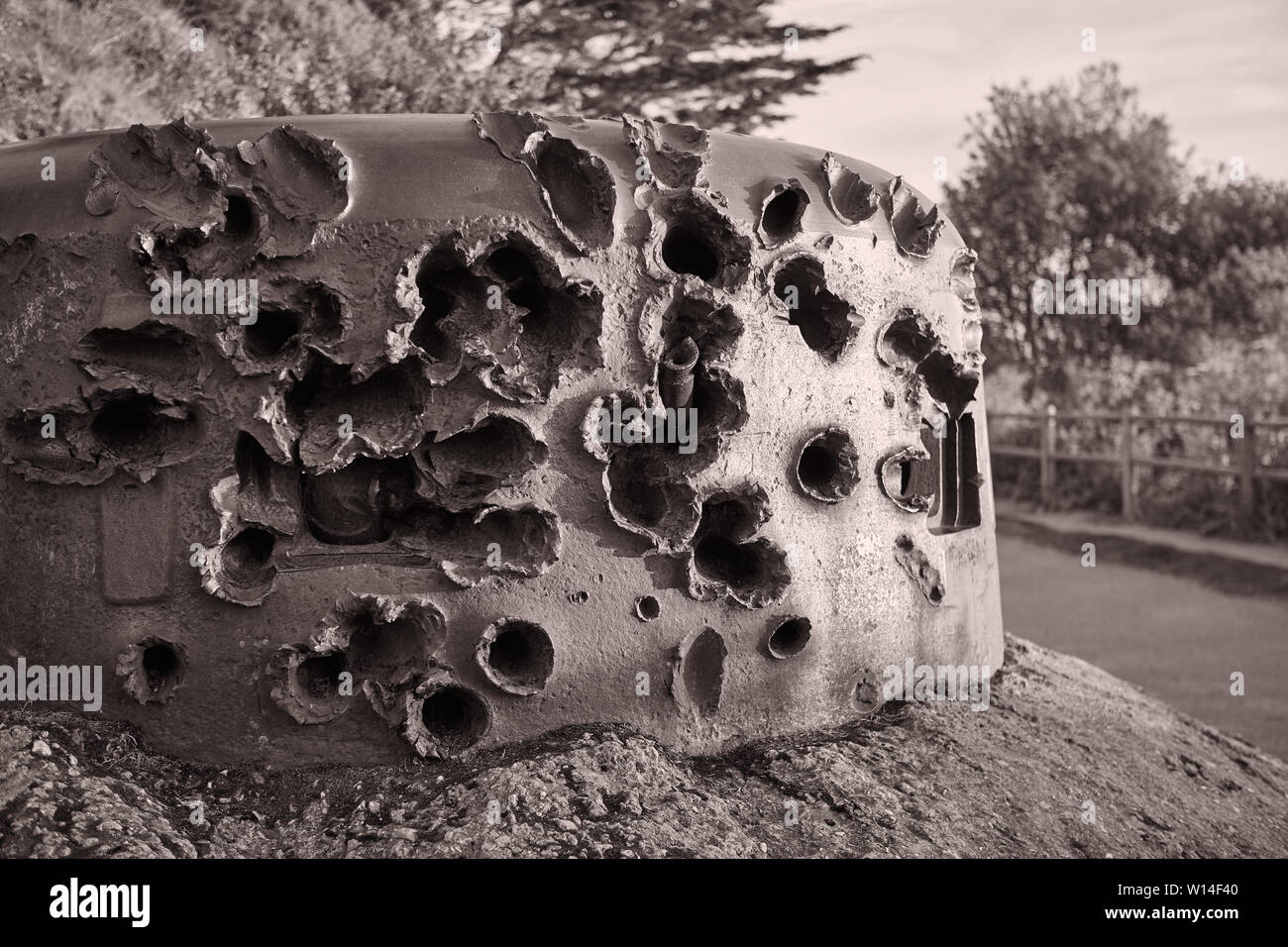Image of WW2 gun implacement which has been heavely shot at whith shells. Stock Photo