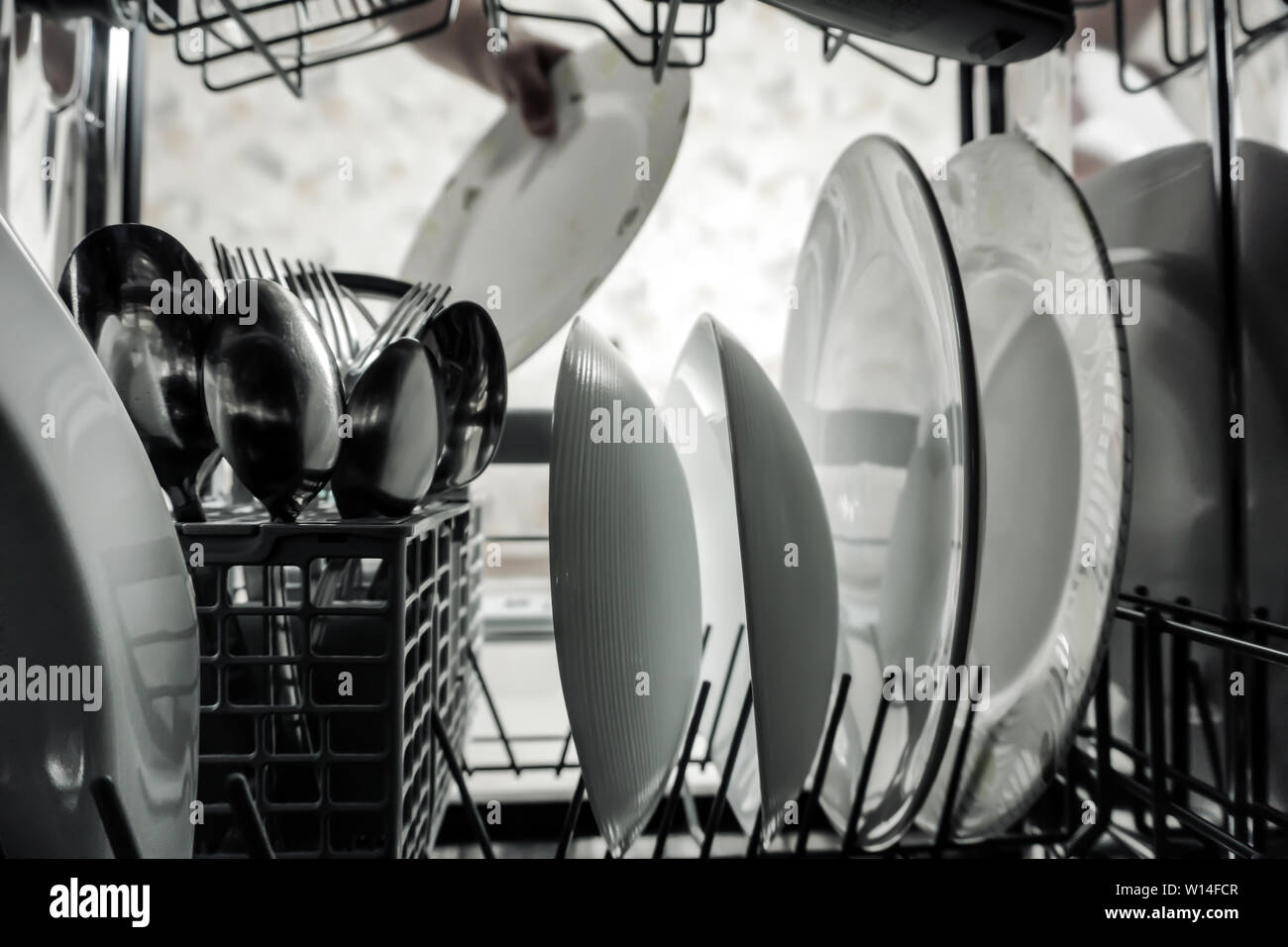 Interior Of Dishwasher Machine With Clean Dishes Stock Photo