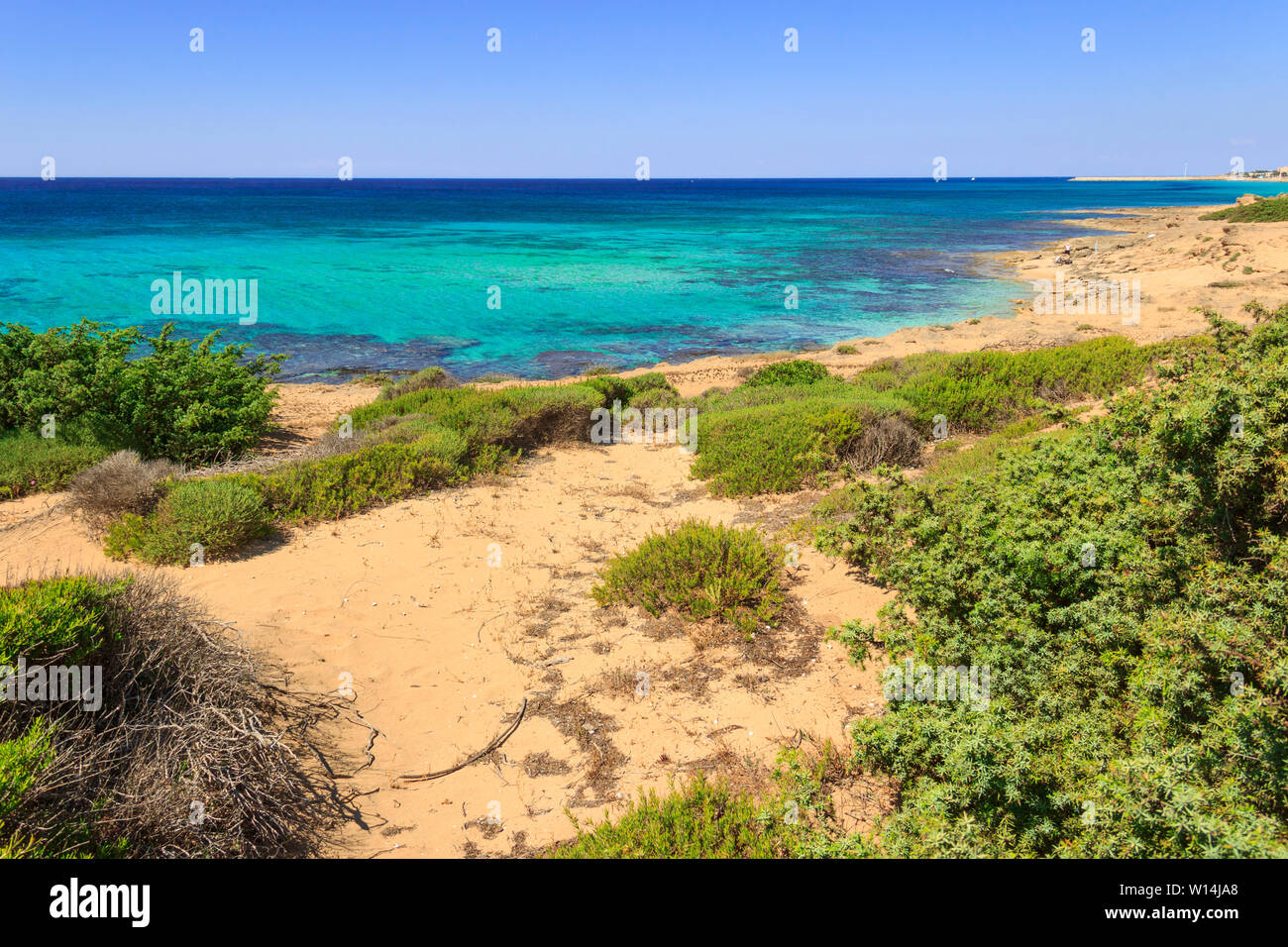 Apulia coast: Marina di Lizzano beach (Taranto). The coastline is characterized by a alternation of sandy coves and jagged cliffs. Stock Photo