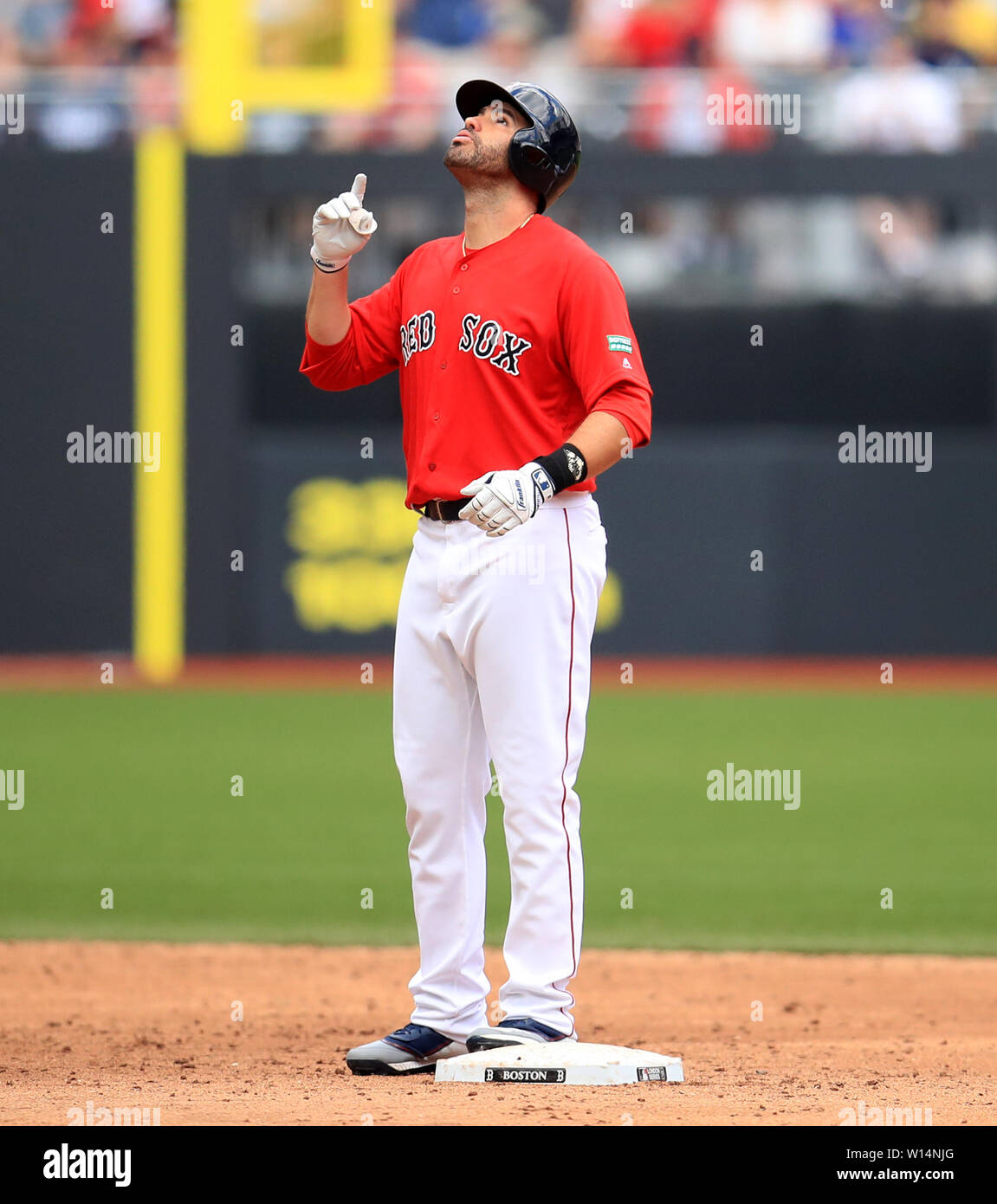 Boston Red Sox' J. D. Martinez reacts after reaching third base during the MLB London Series Match at The London Stadium. Stock Photo