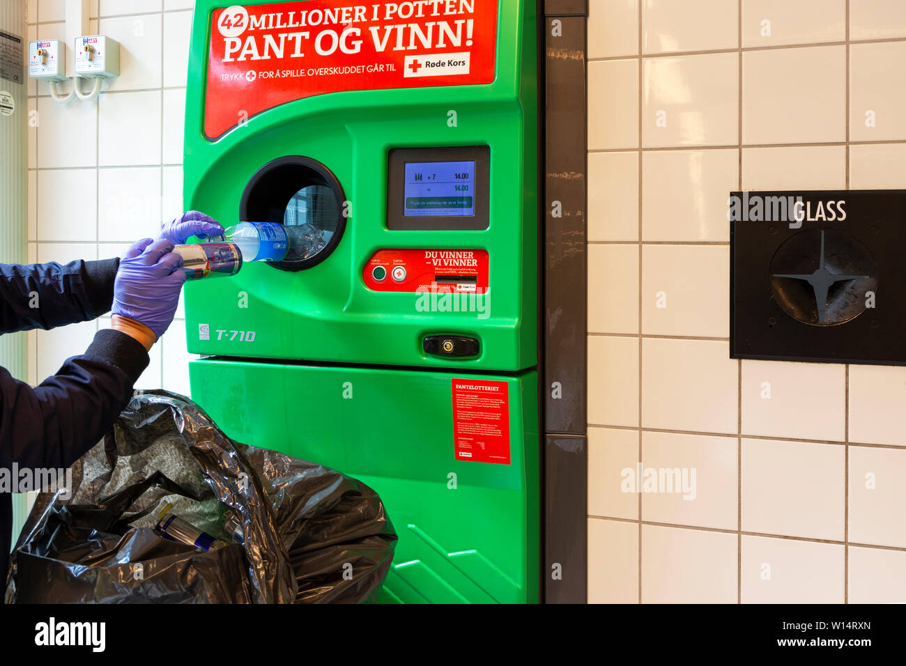 Recycling plastic bottles and tin cans in Norway for money Stock Photo